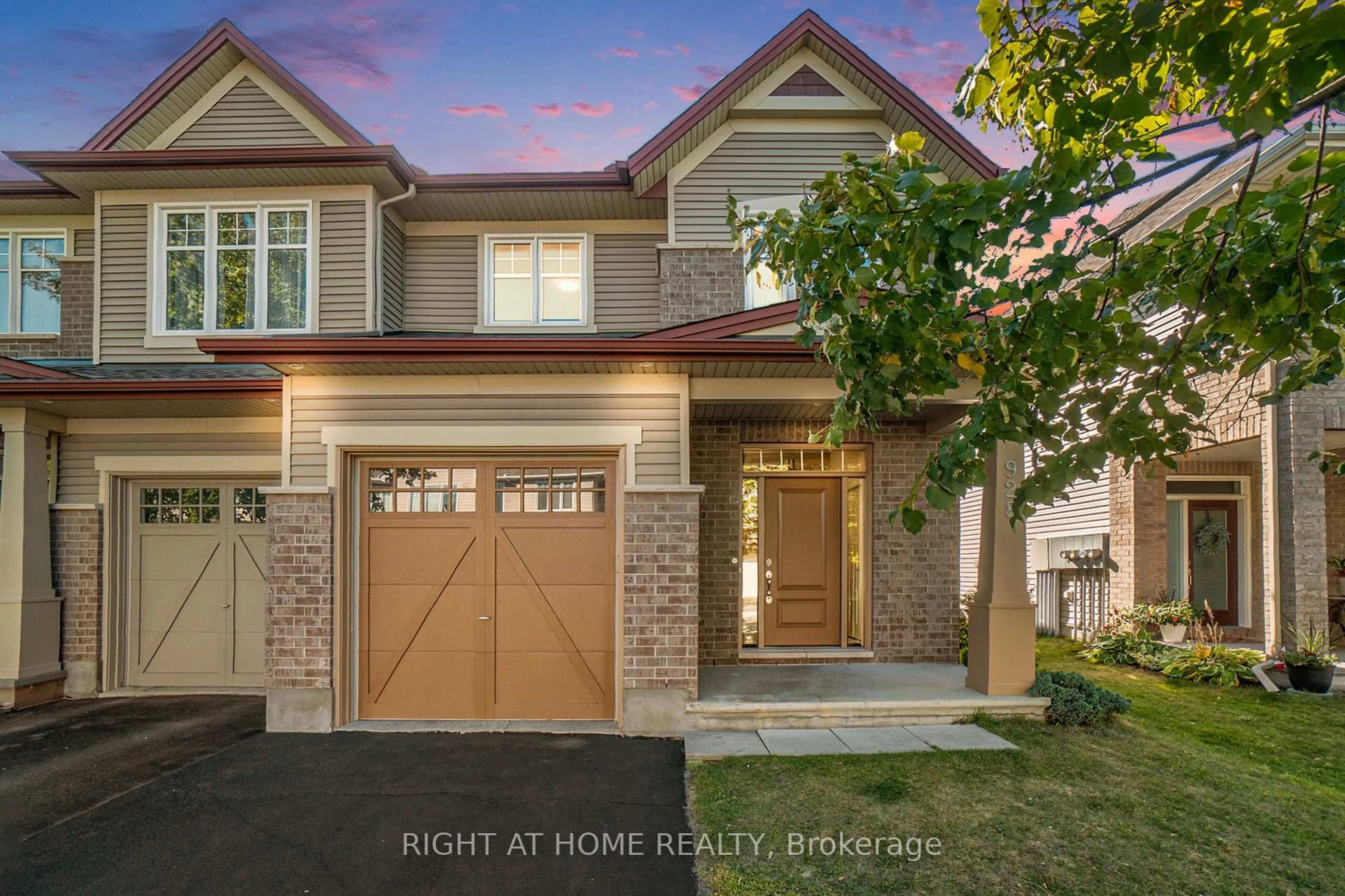 Home with brick exterior material, street for 928 Bunchberry Way, Ottawa Ontario K1T 0L6