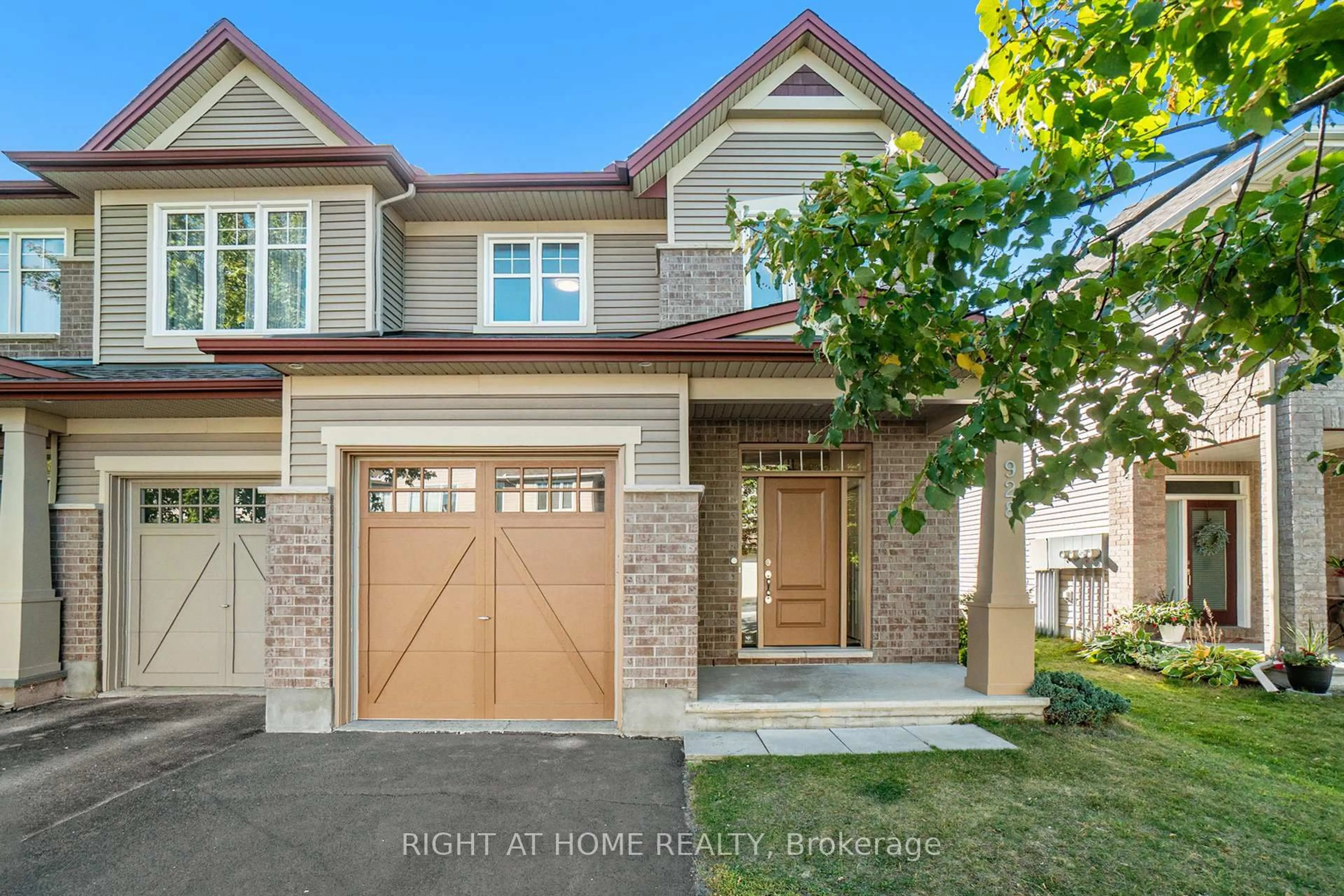 Home with brick exterior material, street for 928 Bunchberry Way, Ottawa Ontario K1T 0L6