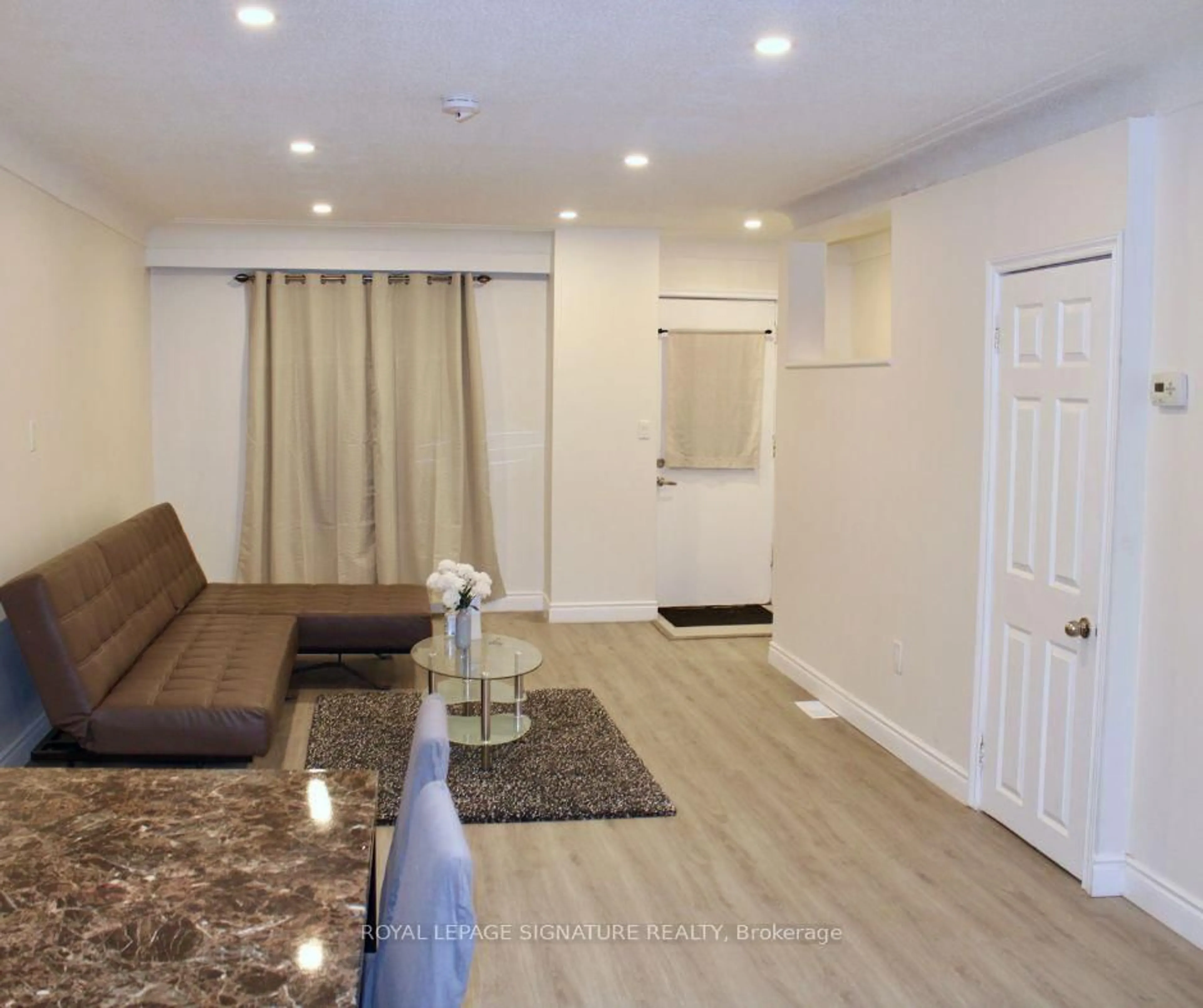 Living room with furniture, wood/laminate floor for 9 Adams St, Hamilton Ontario L8L 5Y1
