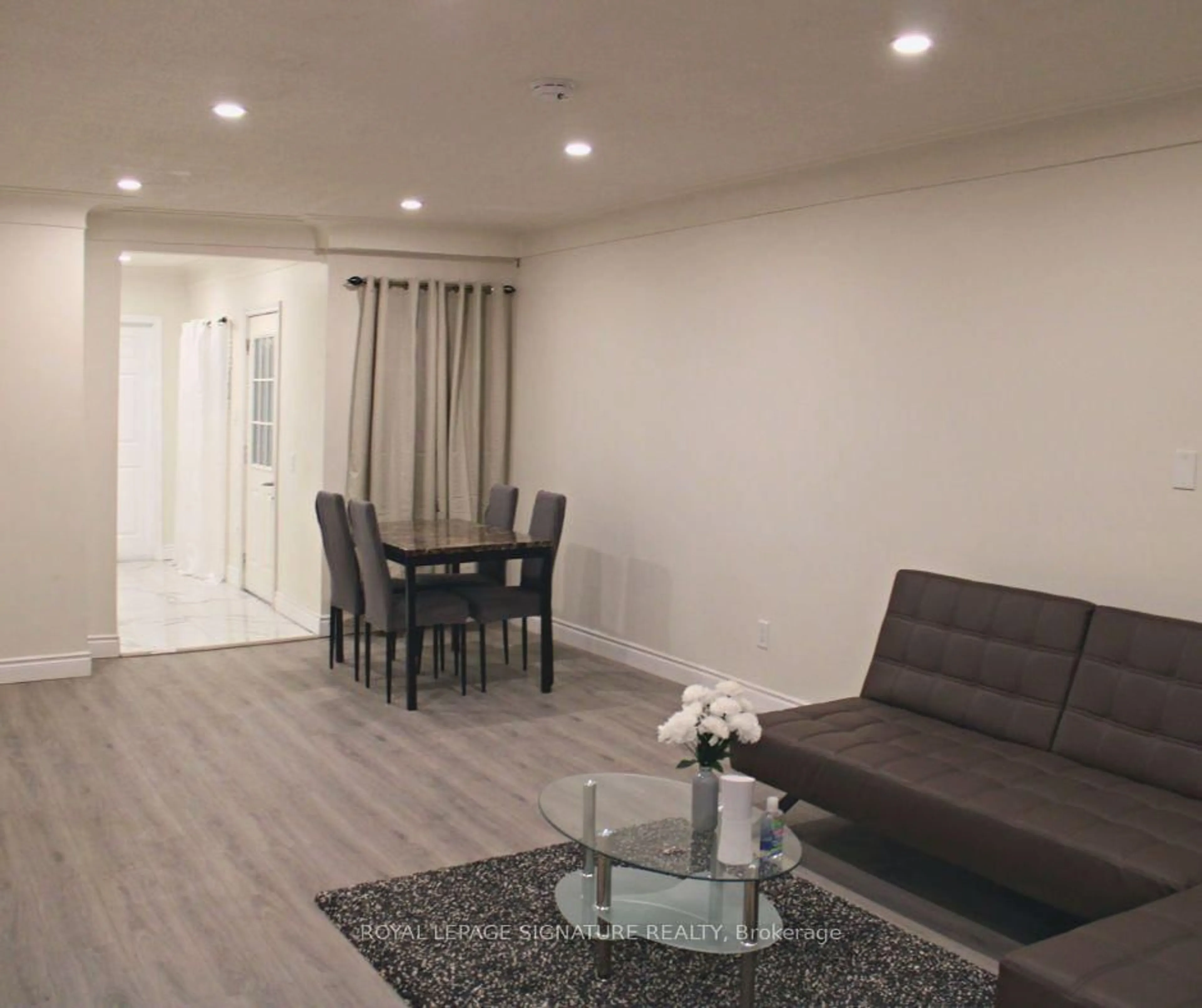 Living room with furniture, wood/laminate floor for 9 Adams St, Hamilton Ontario L8L 5Y1