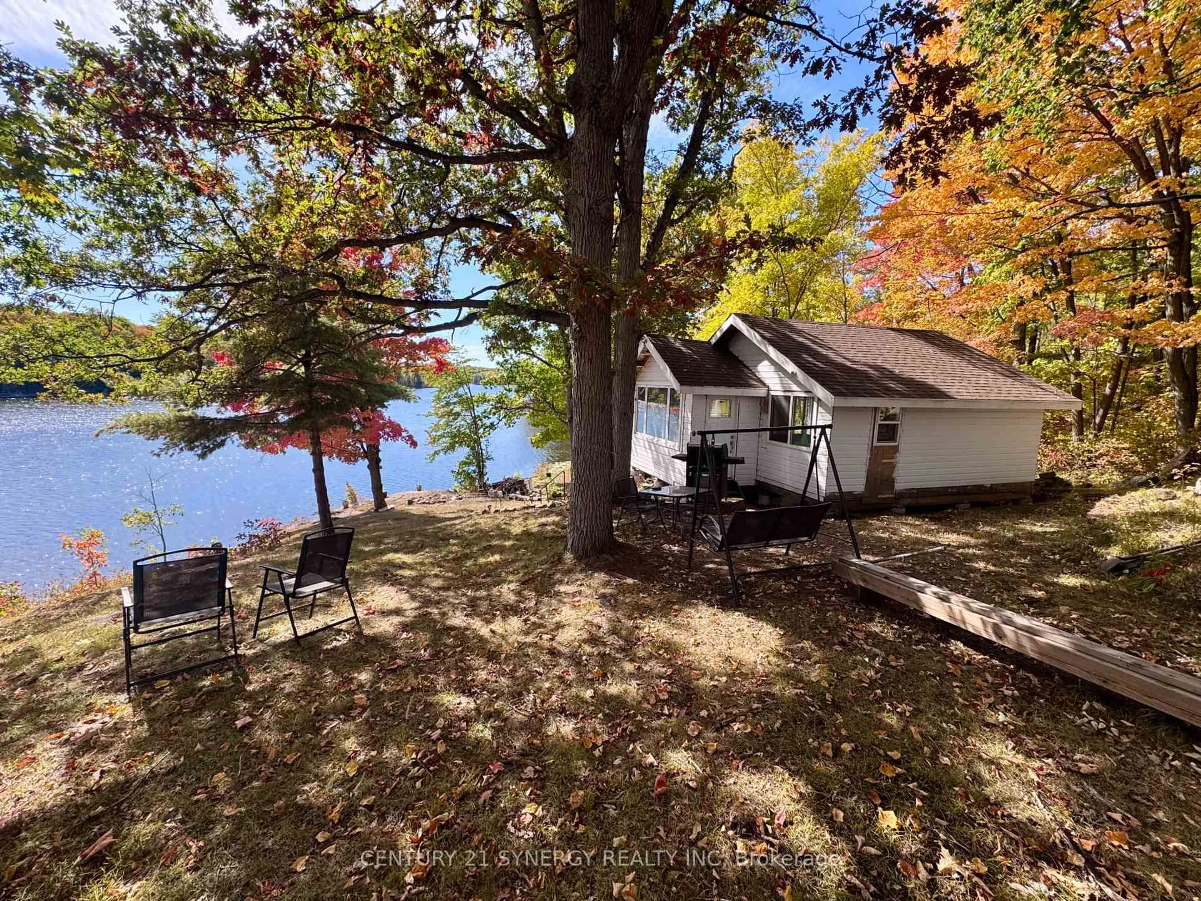 A pic from outside/outdoor area/front of a property/back of a property/a pic from drone, water/lake/river/ocean view for 241 Brash Lane, Frontenac Ontario K0H 1R0