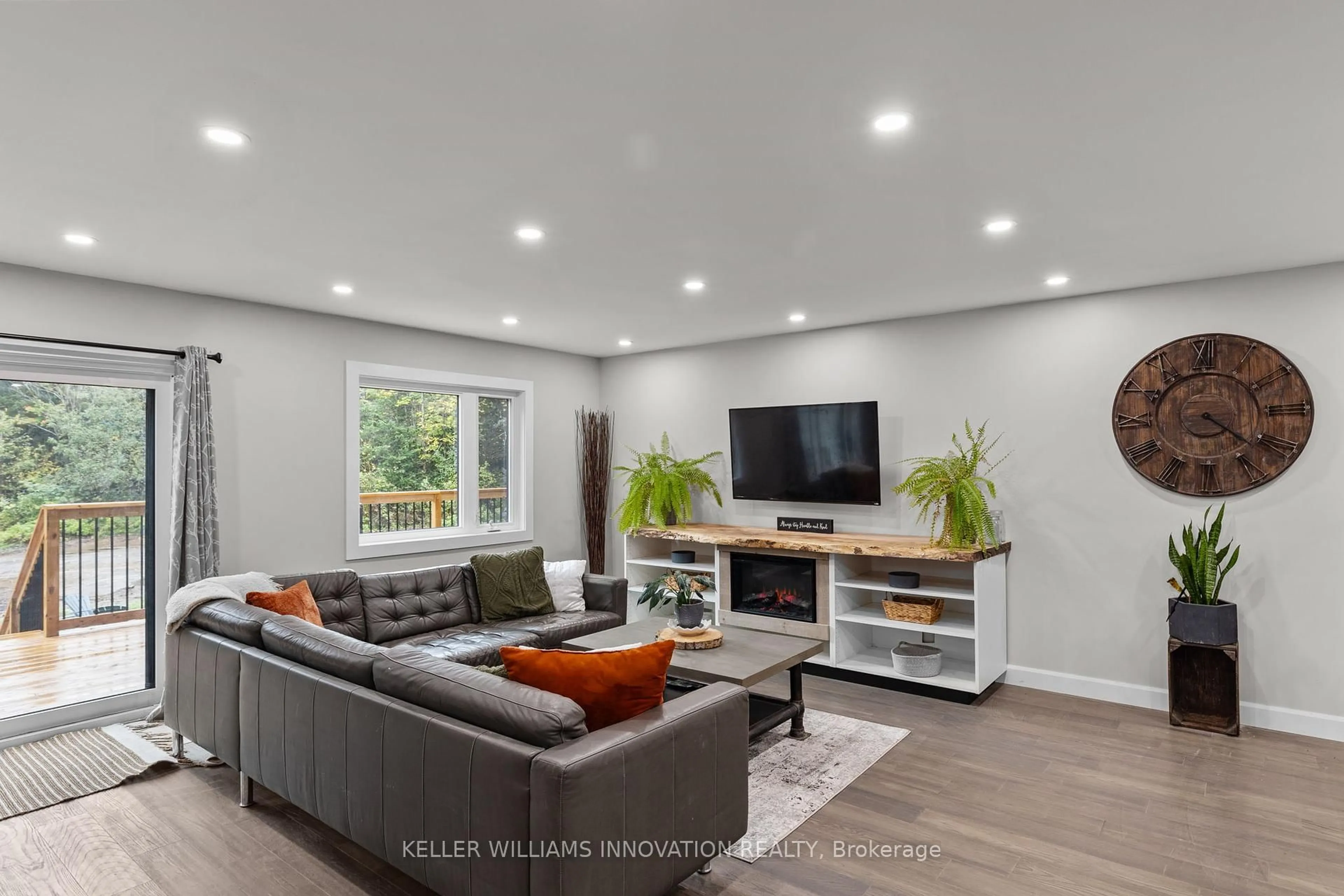 Living room with furniture, wood/laminate floor for 127 Paradise Rd, South Algonquin Ontario K0J 2M0