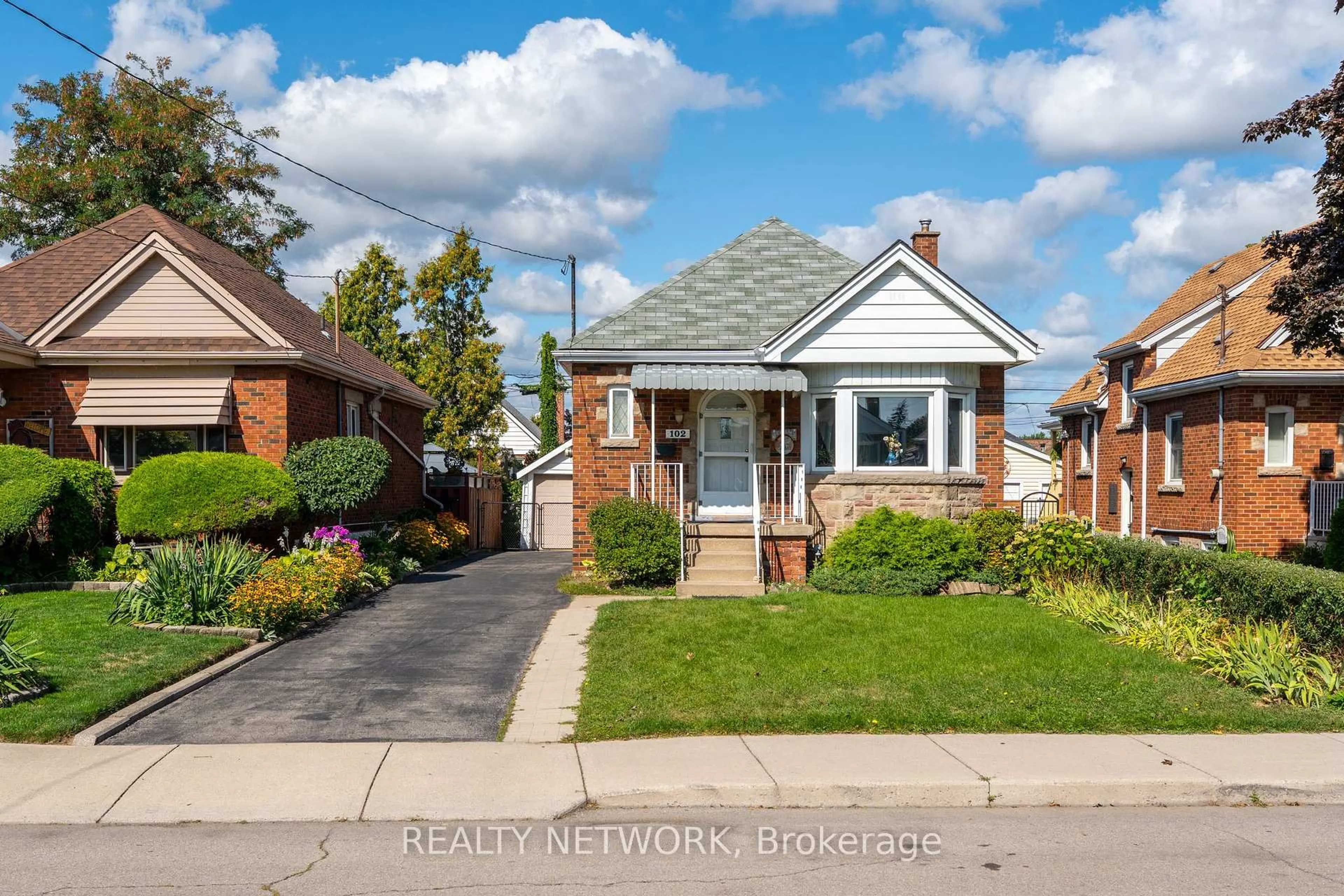 Home with brick exterior material, street for 102 Barons Ave, Hamilton Ontario L8K 2Y6