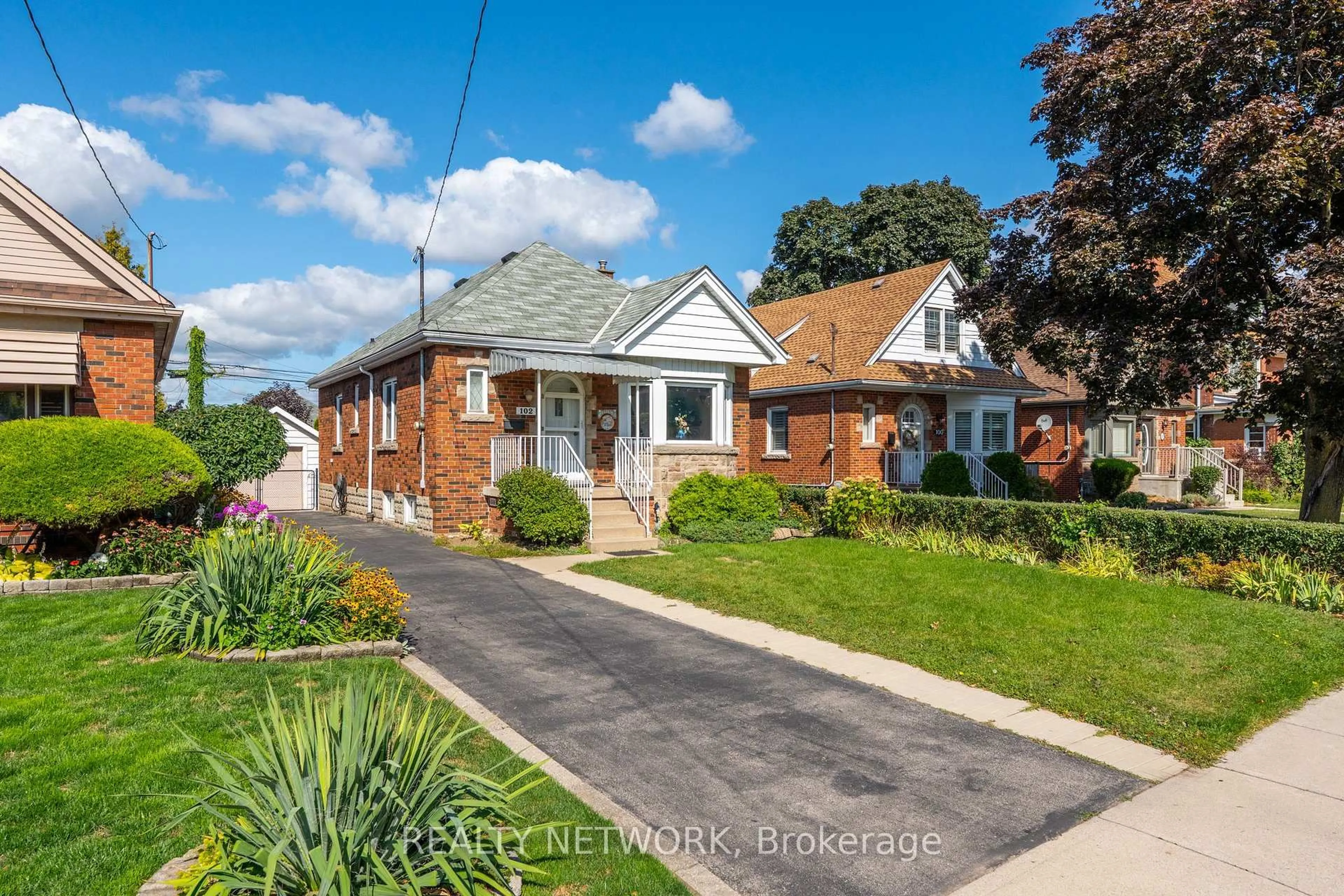 Home with brick exterior material, street for 102 Barons Ave, Hamilton Ontario L8K 2Y6