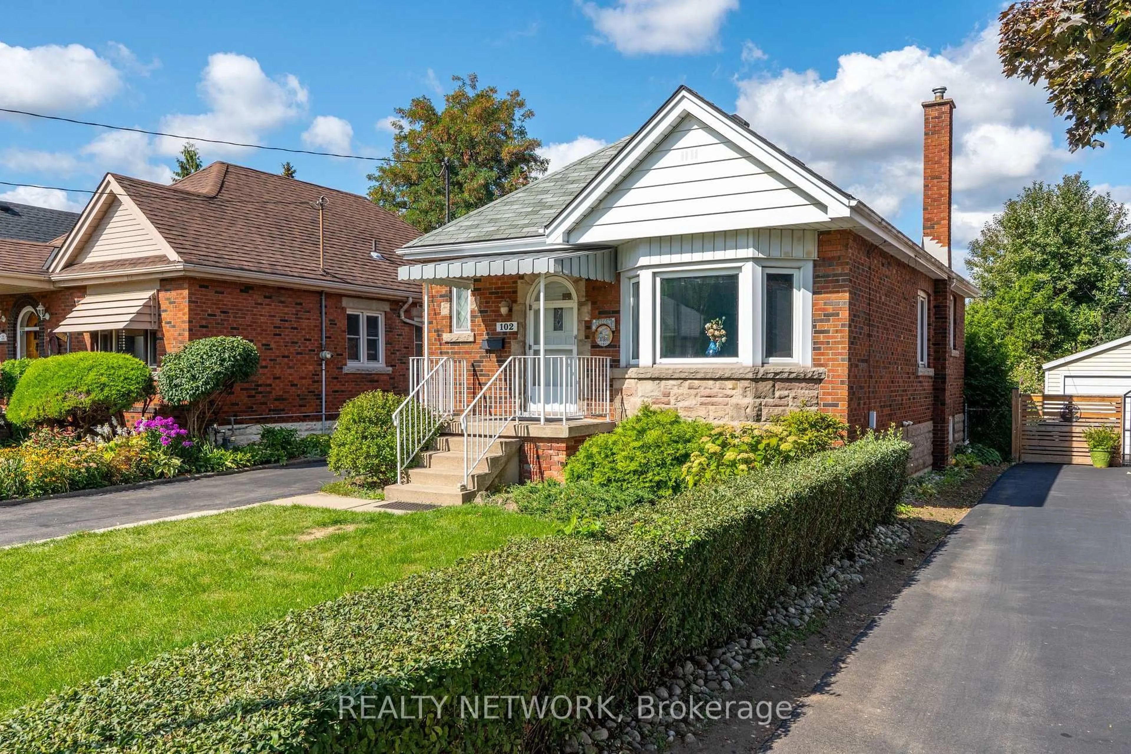 Home with brick exterior material, street for 102 Barons Ave, Hamilton Ontario L8K 2Y6