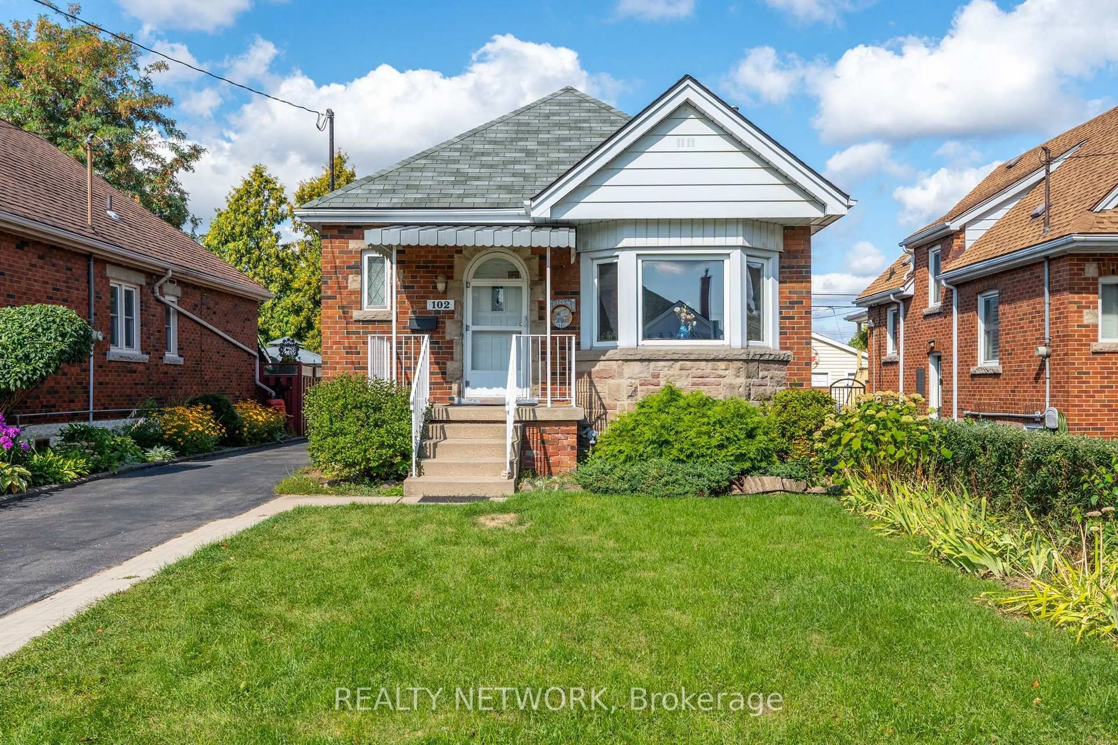 Home with brick exterior material, street for 102 Barons Ave, Hamilton Ontario L8K 2Y6