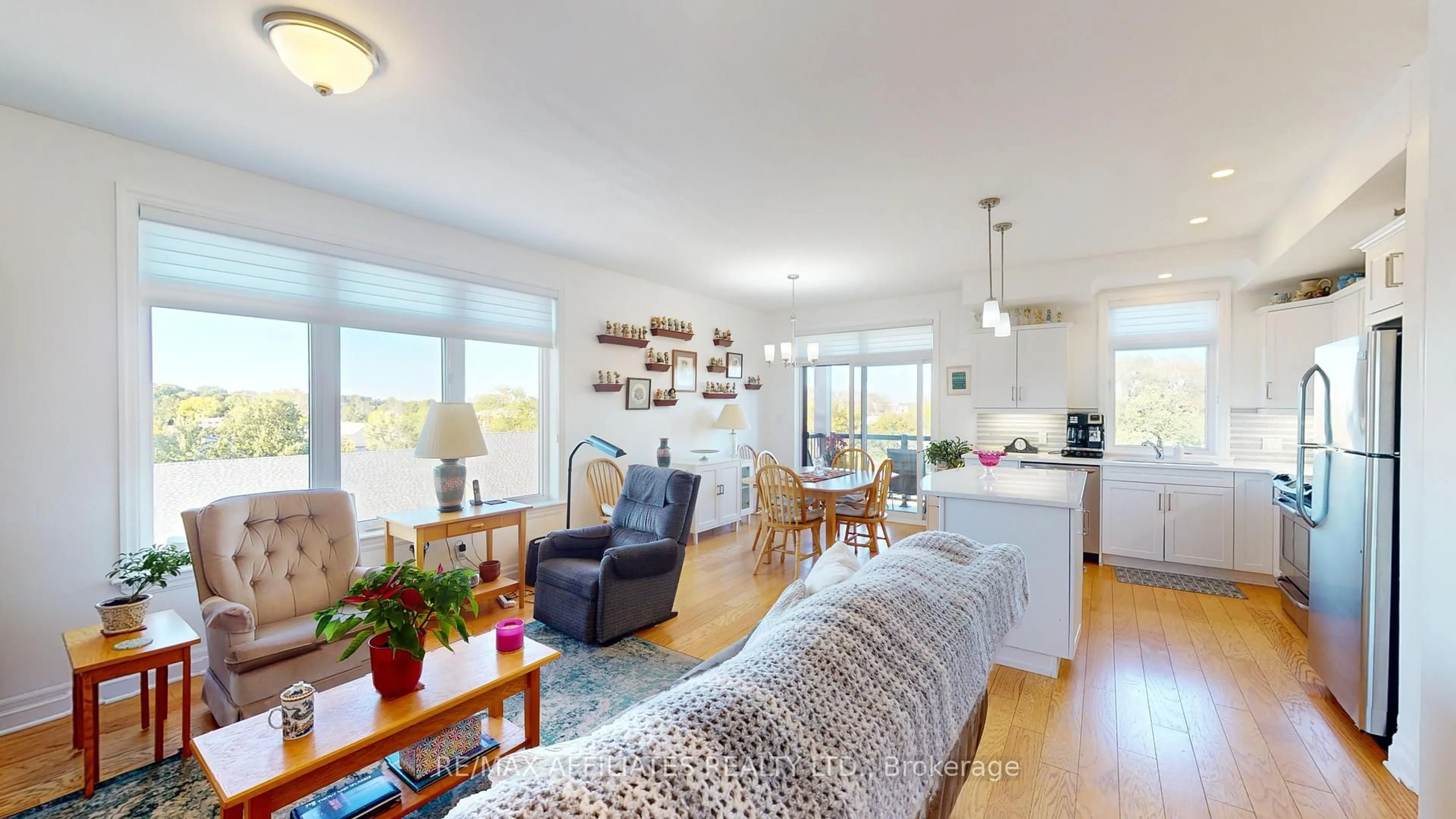Open concept kitchen, wood/laminate floor for 1109 Millwood Ave #302, Brockville Ontario K6V 0C7