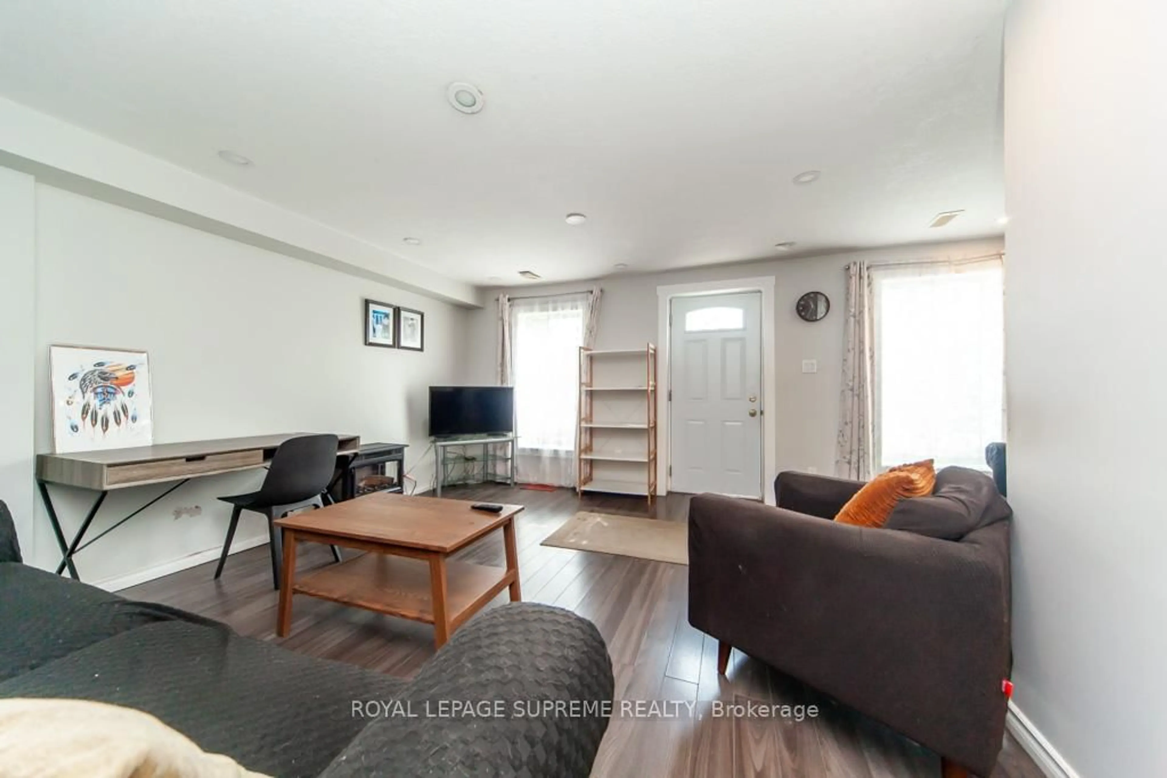 Living room with furniture, wood/laminate floor for 13 Robins Ave, Hamilton Ontario L8H 4M5