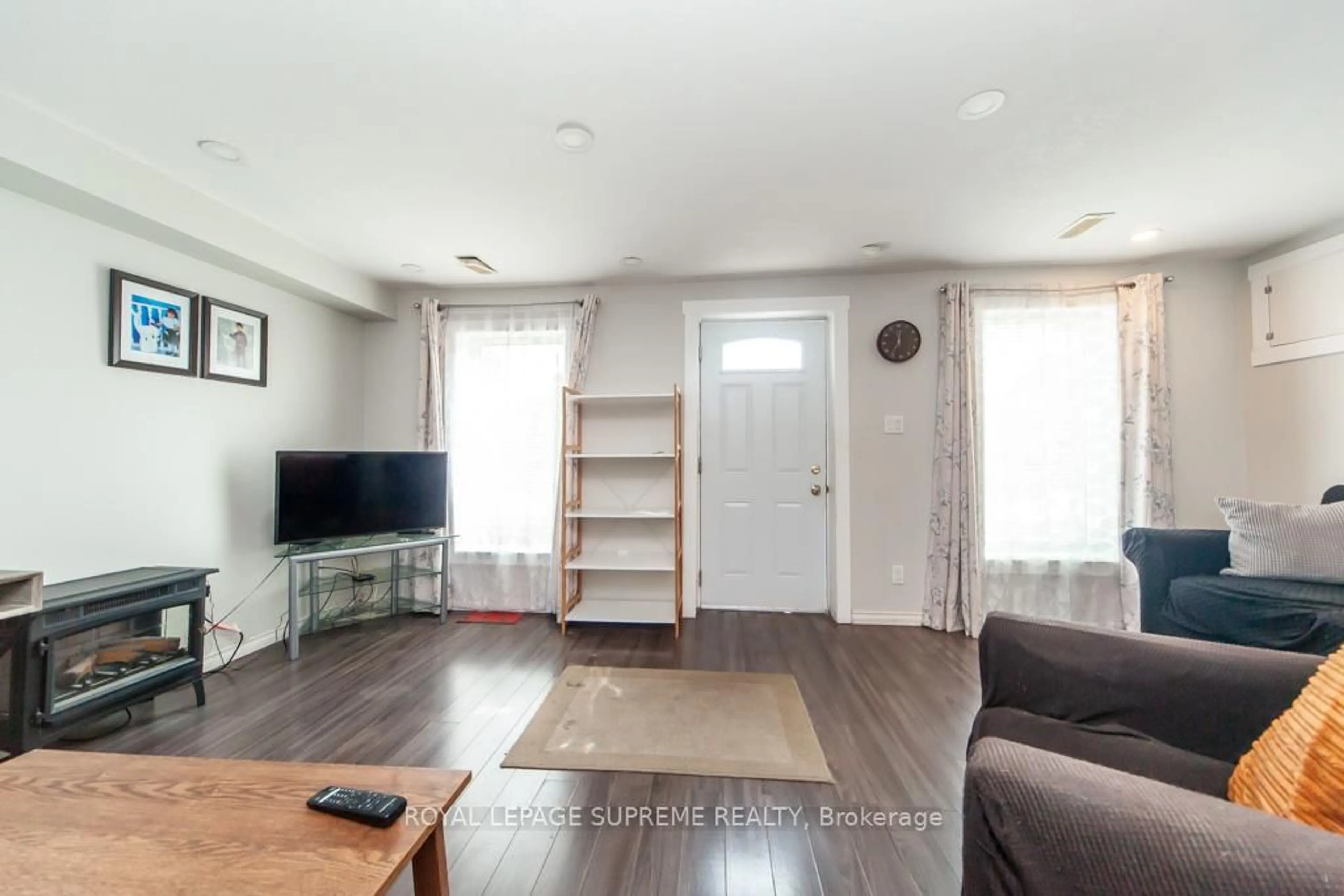 Living room with furniture, wood/laminate floor for 13 Robins Ave, Hamilton Ontario L8H 4M5
