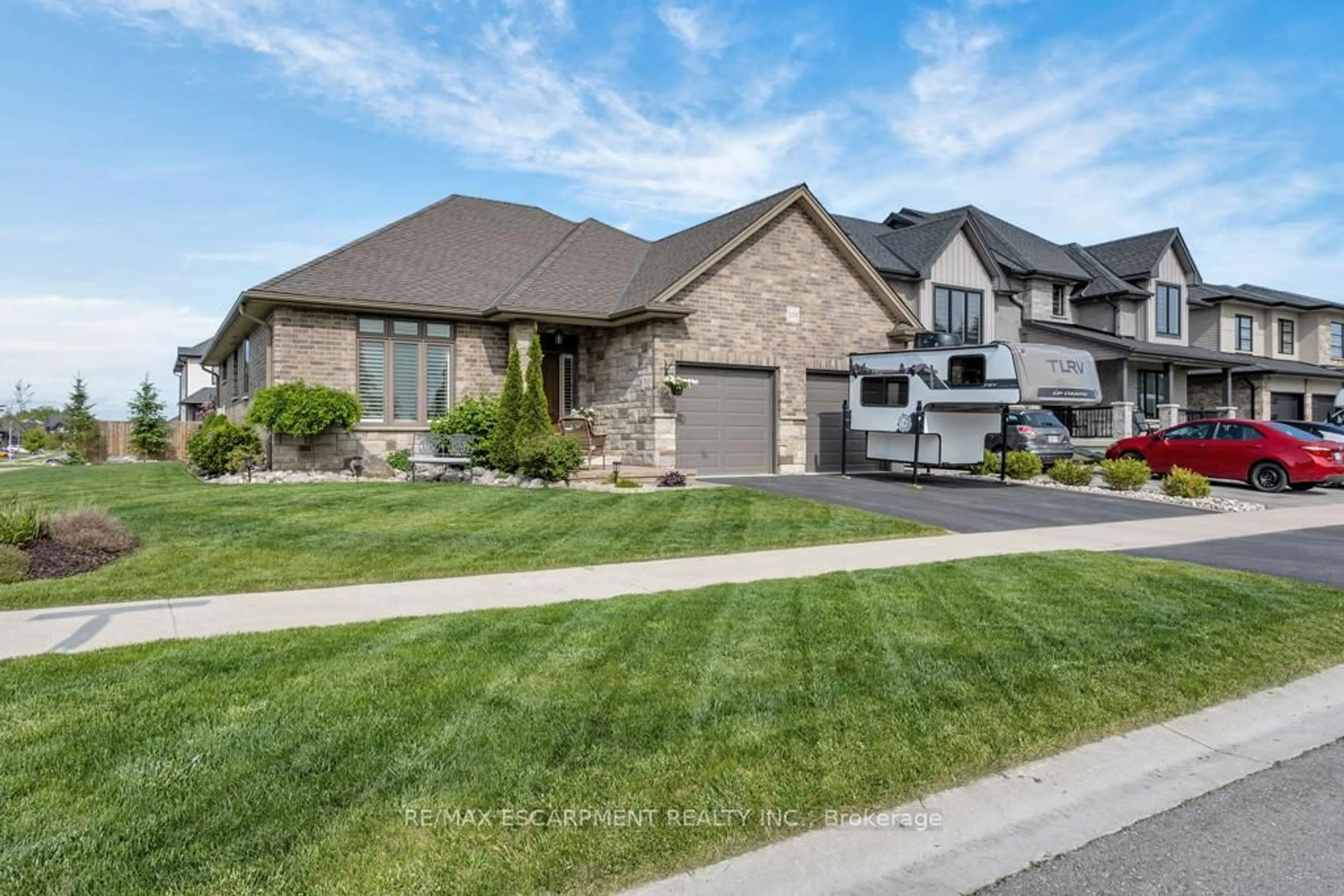 Home with brick exterior material, street for 100 Tamarack Blvd, Woodstock Ontario N4S 0E2