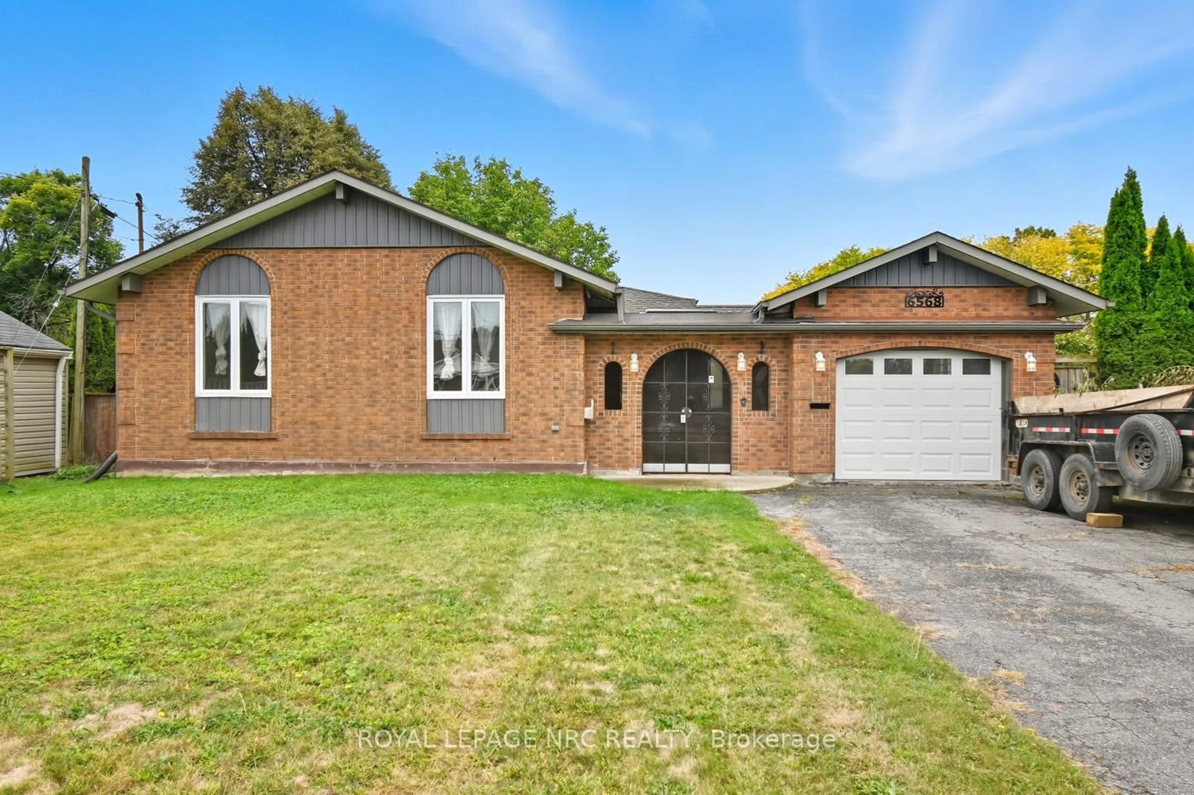 Home with brick exterior material, street for 6568 Riall St, Niagara Falls Ontario L2J 1Z6