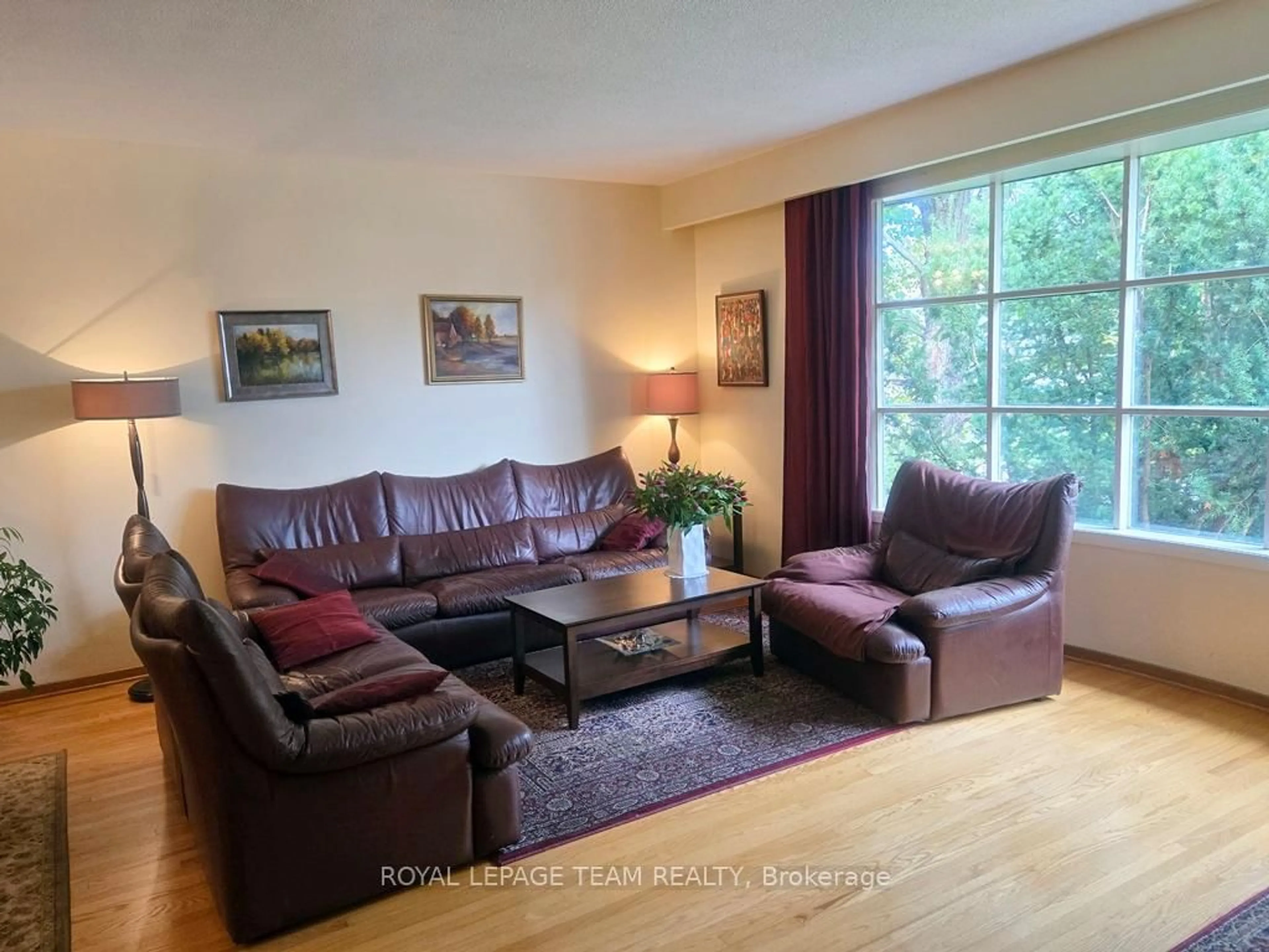 Living room with furniture, wood/laminate floor for 18 Diceman Cres, Ottawa Ontario K1B 3Y3