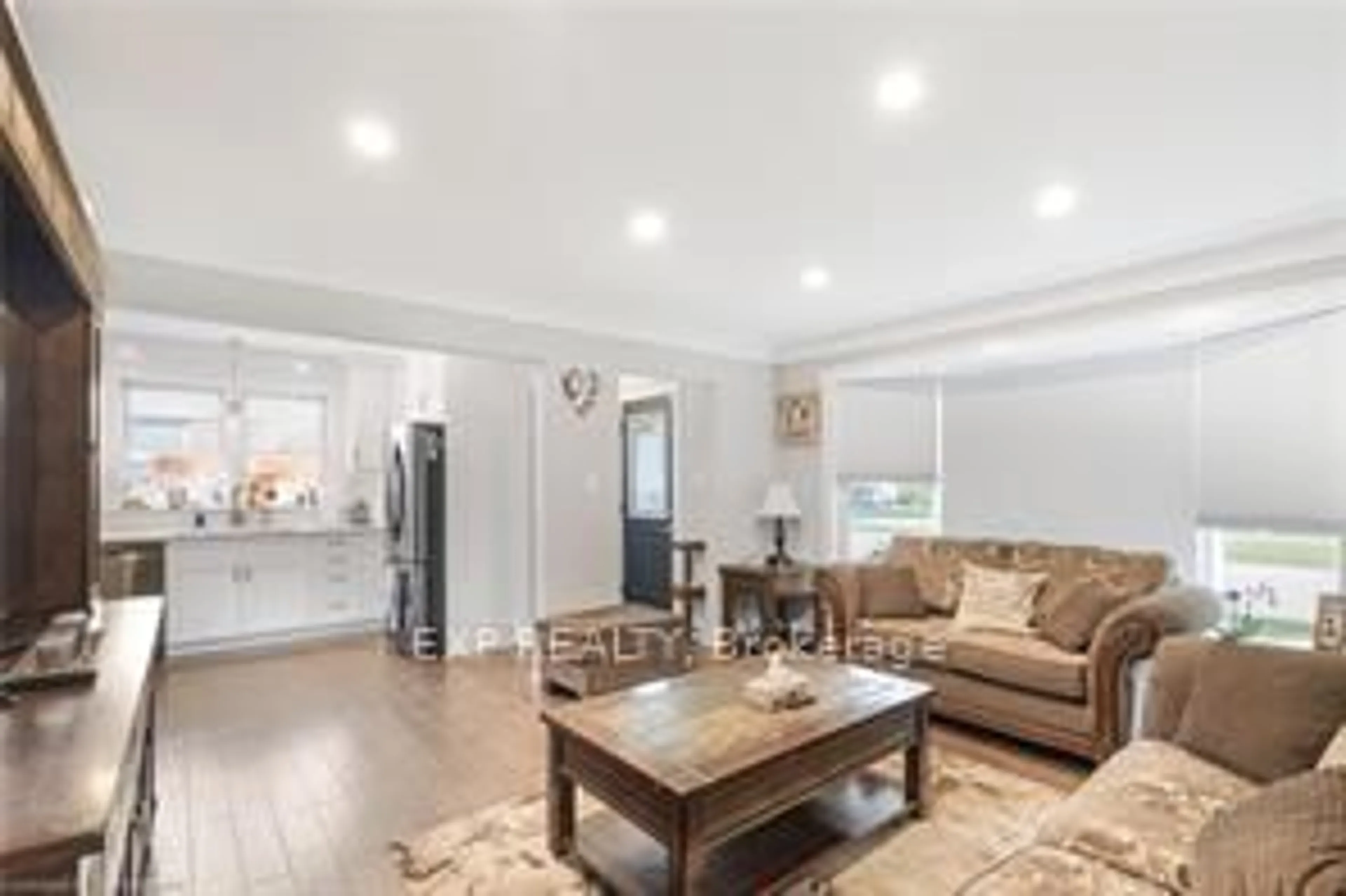 Living room with furniture, wood/laminate floor for 1057 Clare Ave, Cambridge Ontario N3H 2E2