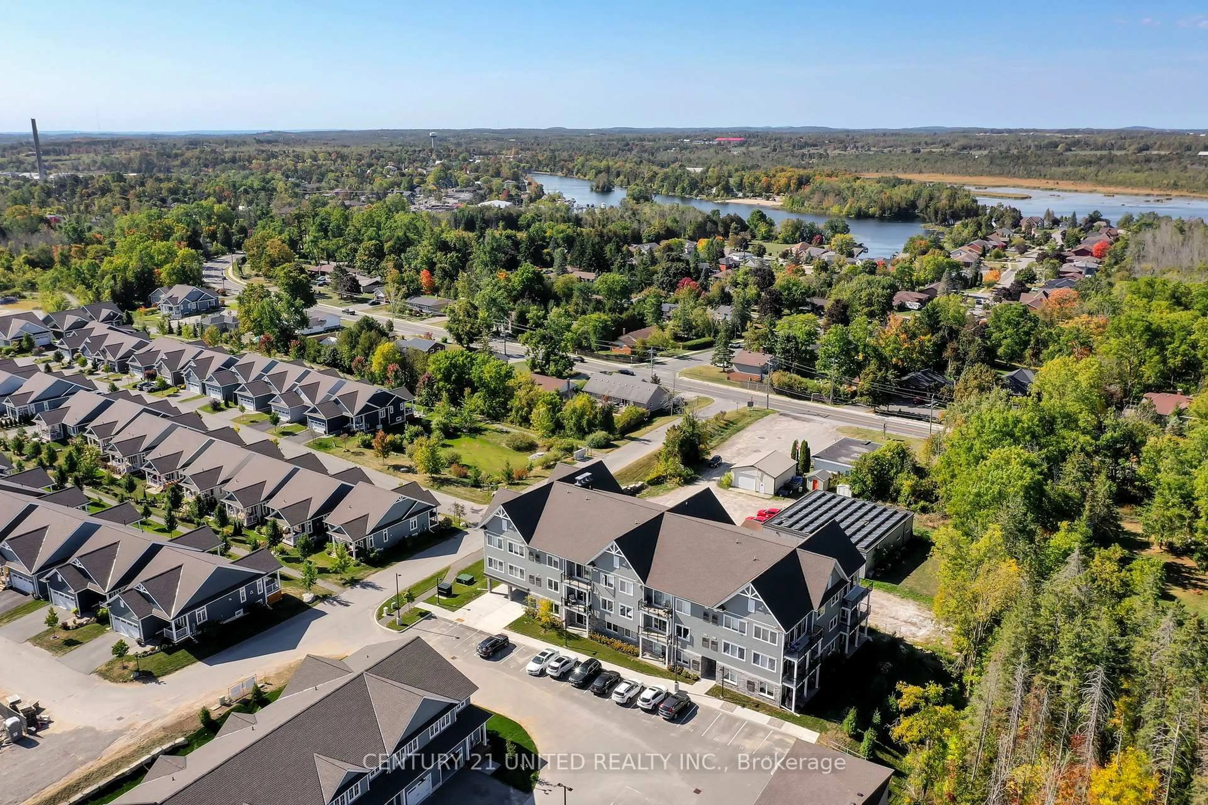 A pic from outside/outdoor area/front of a property/back of a property/a pic from drone, water/lake/river/ocean view for 19 Hampton Lane #202, Selwyn Ontario K0L 2H0