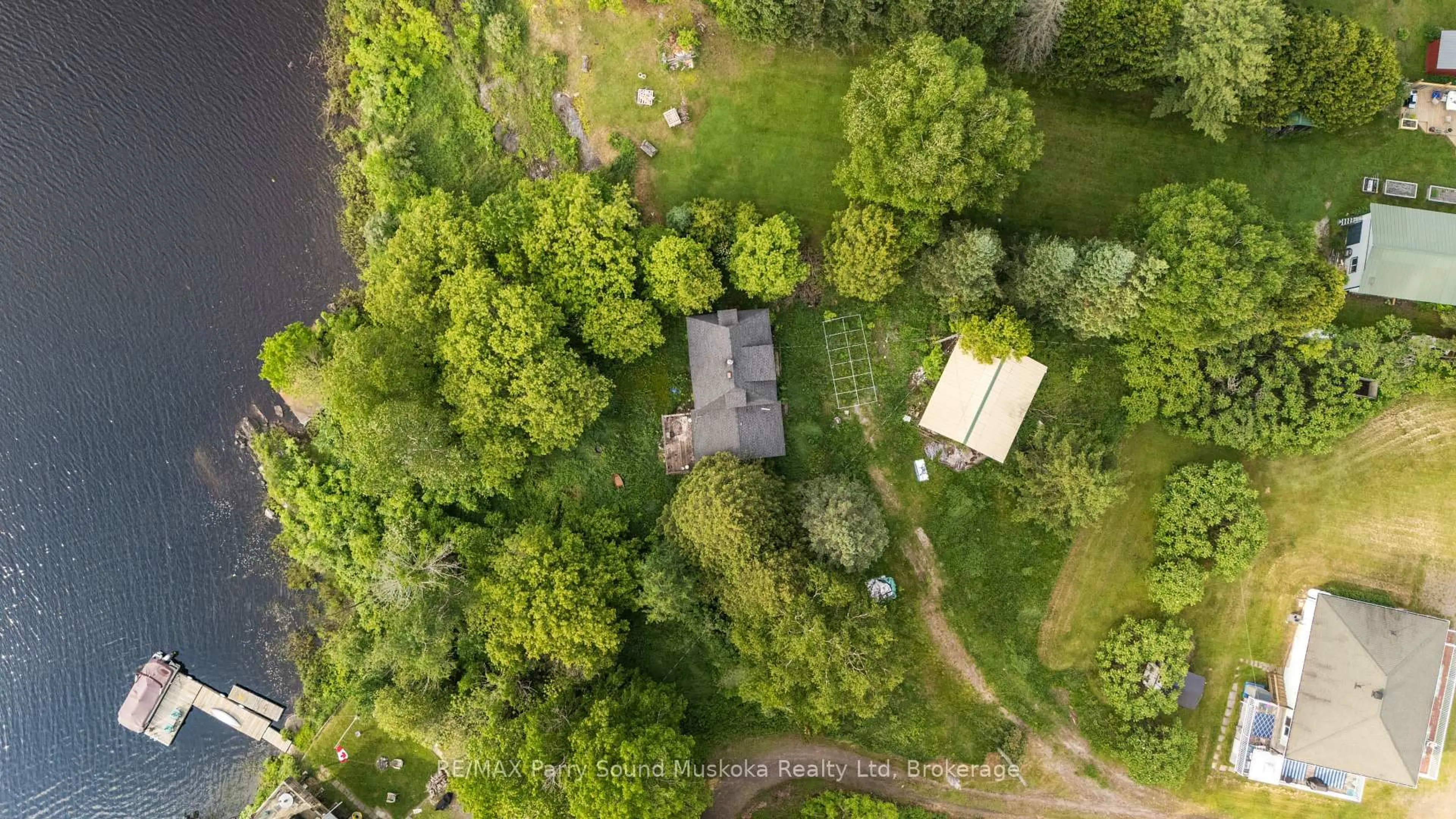 A pic from outside/outdoor area/front of a property/back of a property/a pic from drone, forest/trees view for 5 Bellview Cres, Whitestone Ontario P0A 1G0