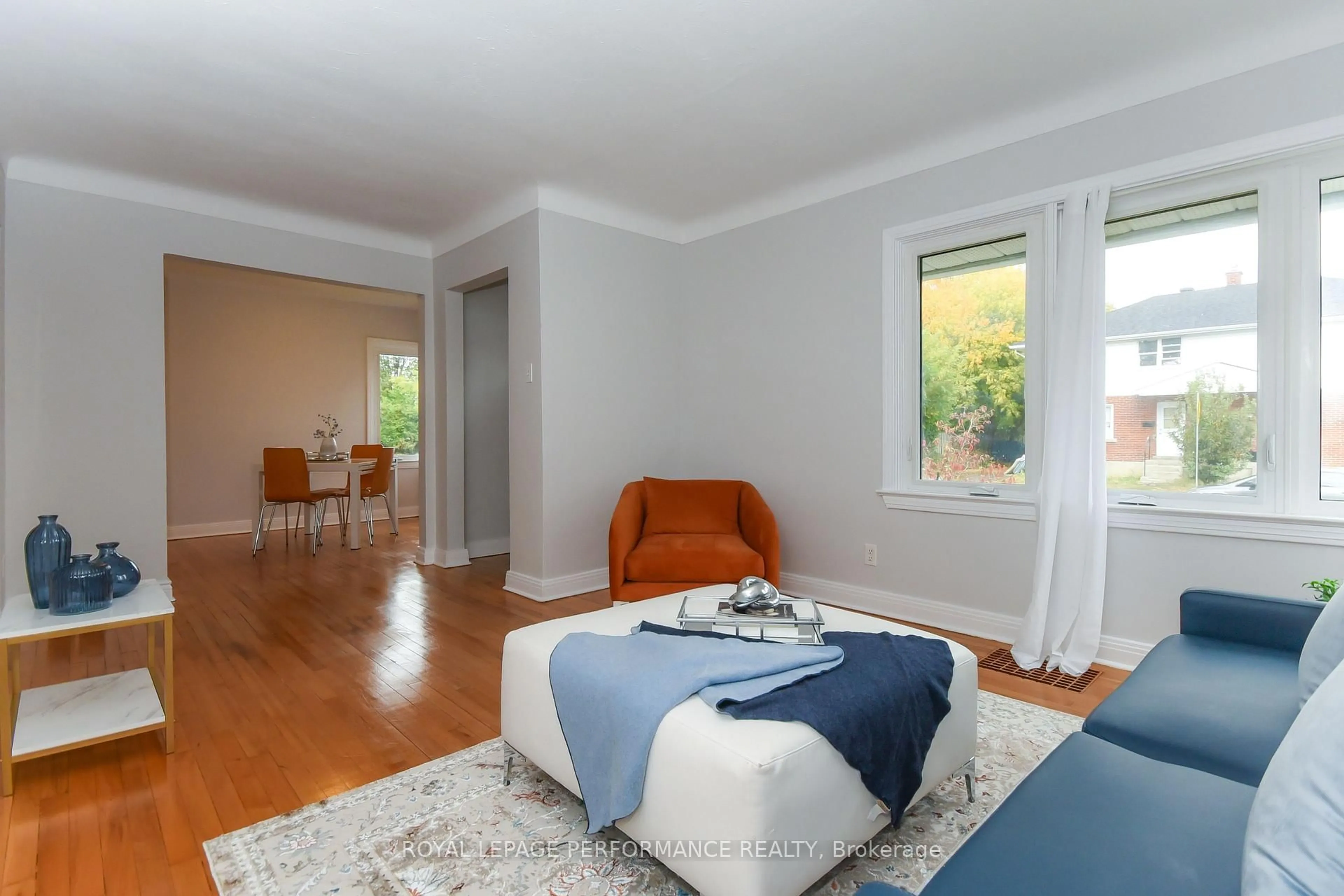 Living room with furniture, wood/laminate floor for 274 Queen Mary St, Ottawa Ontario K1K 1X2
