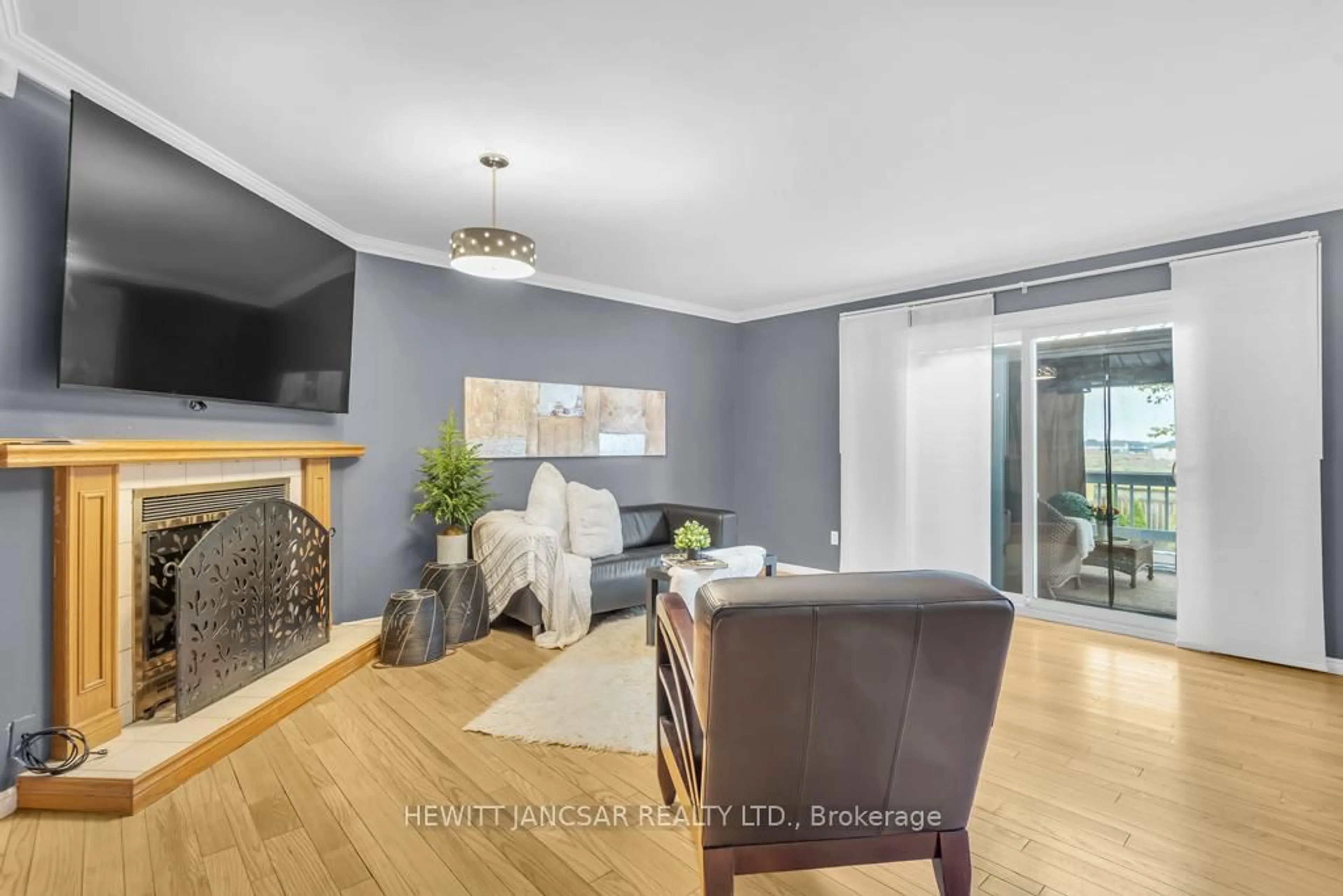 Living room with furniture, wood/laminate floor for 123 John Davies Dr, Woodstock Ontario N4T 1N2
