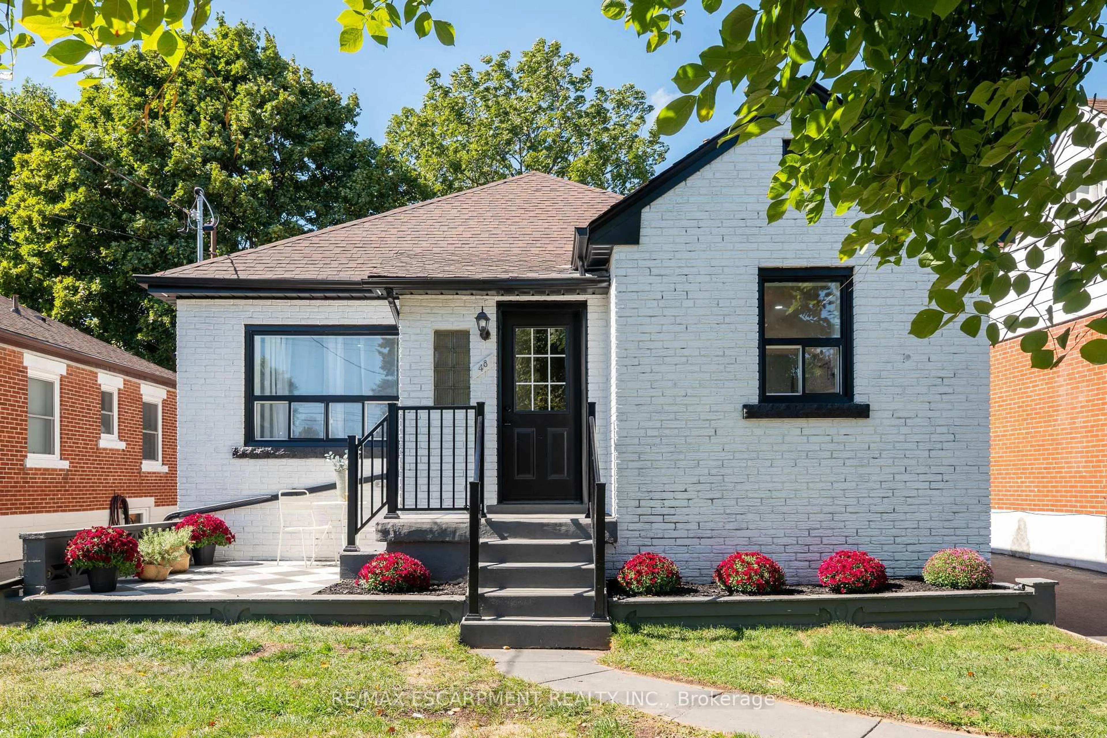Home with brick exterior material, street for 48 Woodbridge Rd, Hamilton Ontario L8K 3C9