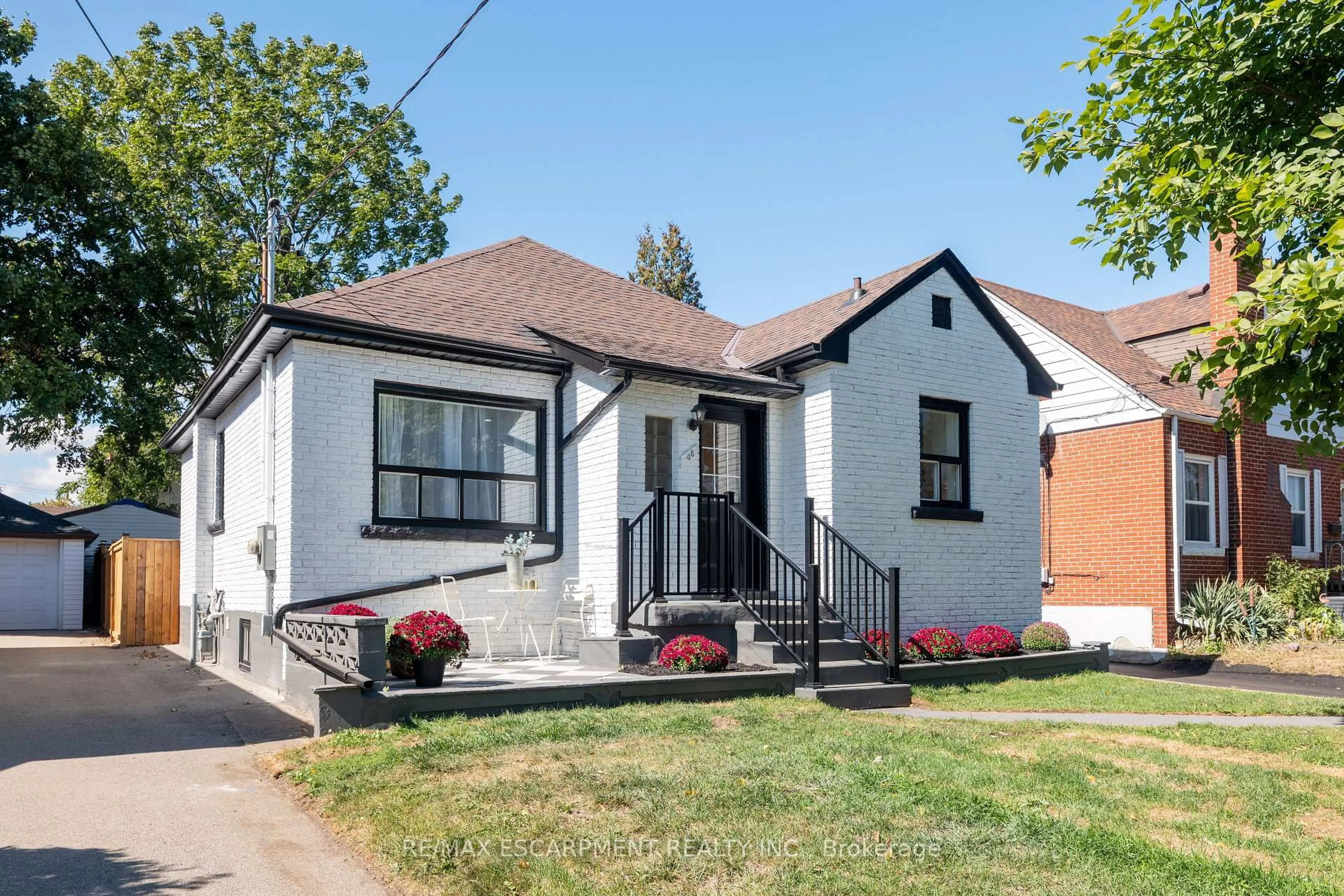 Home with brick exterior material, street for 48 Woodbridge Rd, Hamilton Ontario L8K 3C9