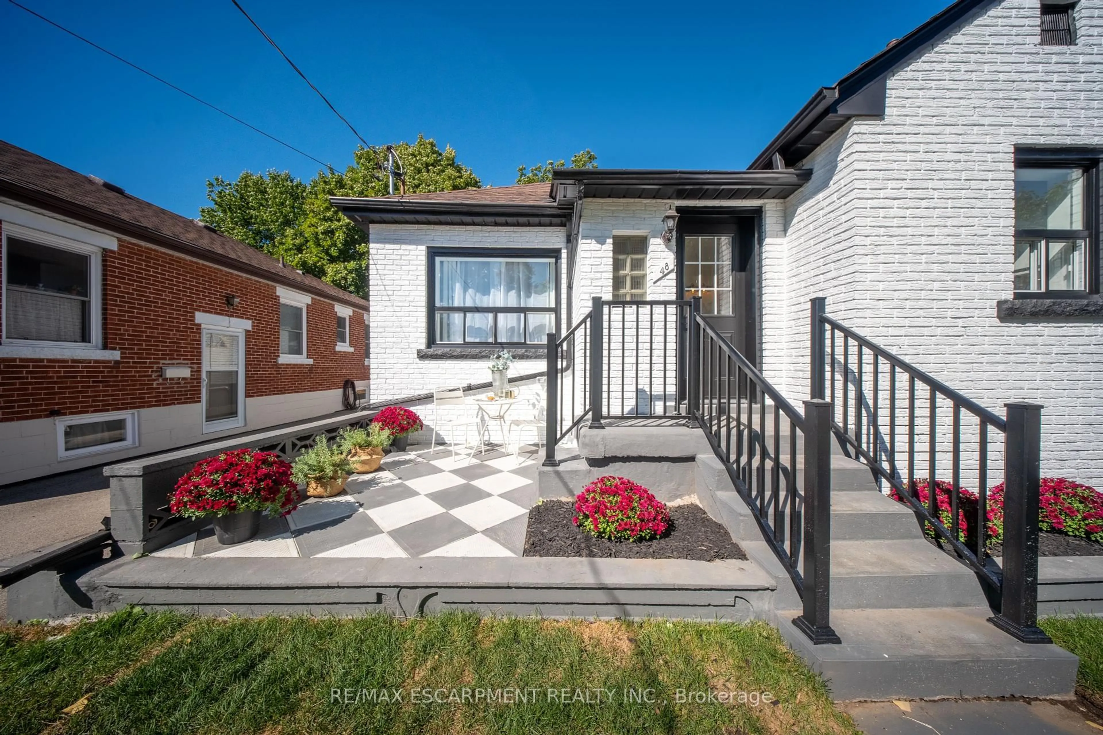 Home with brick exterior material, street for 48 Woodbridge Rd, Hamilton Ontario L8K 3C9