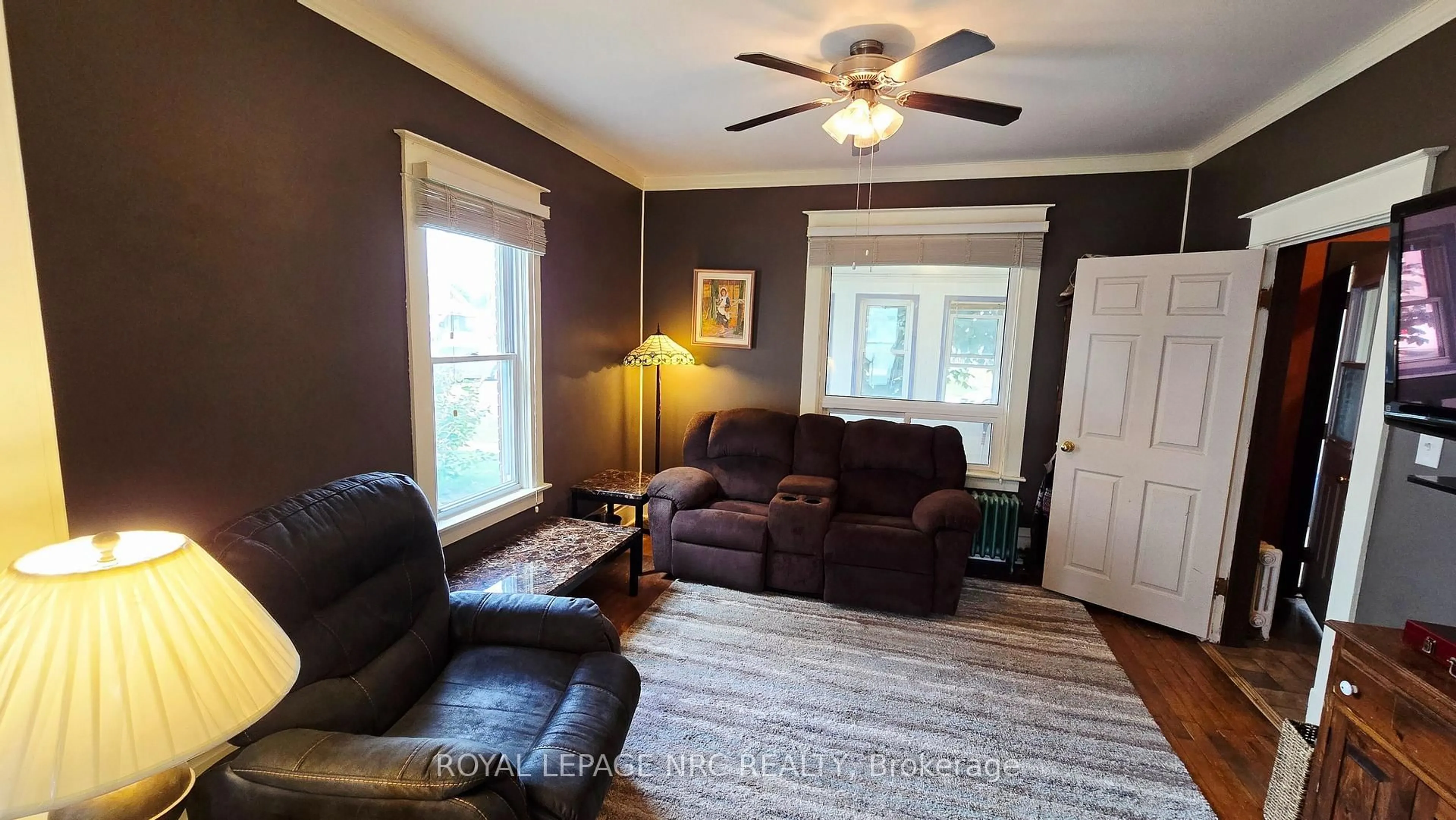 Living room with furniture, wood/laminate floor for 74 Delhi St, Port Colborne Ontario L3K 3K8