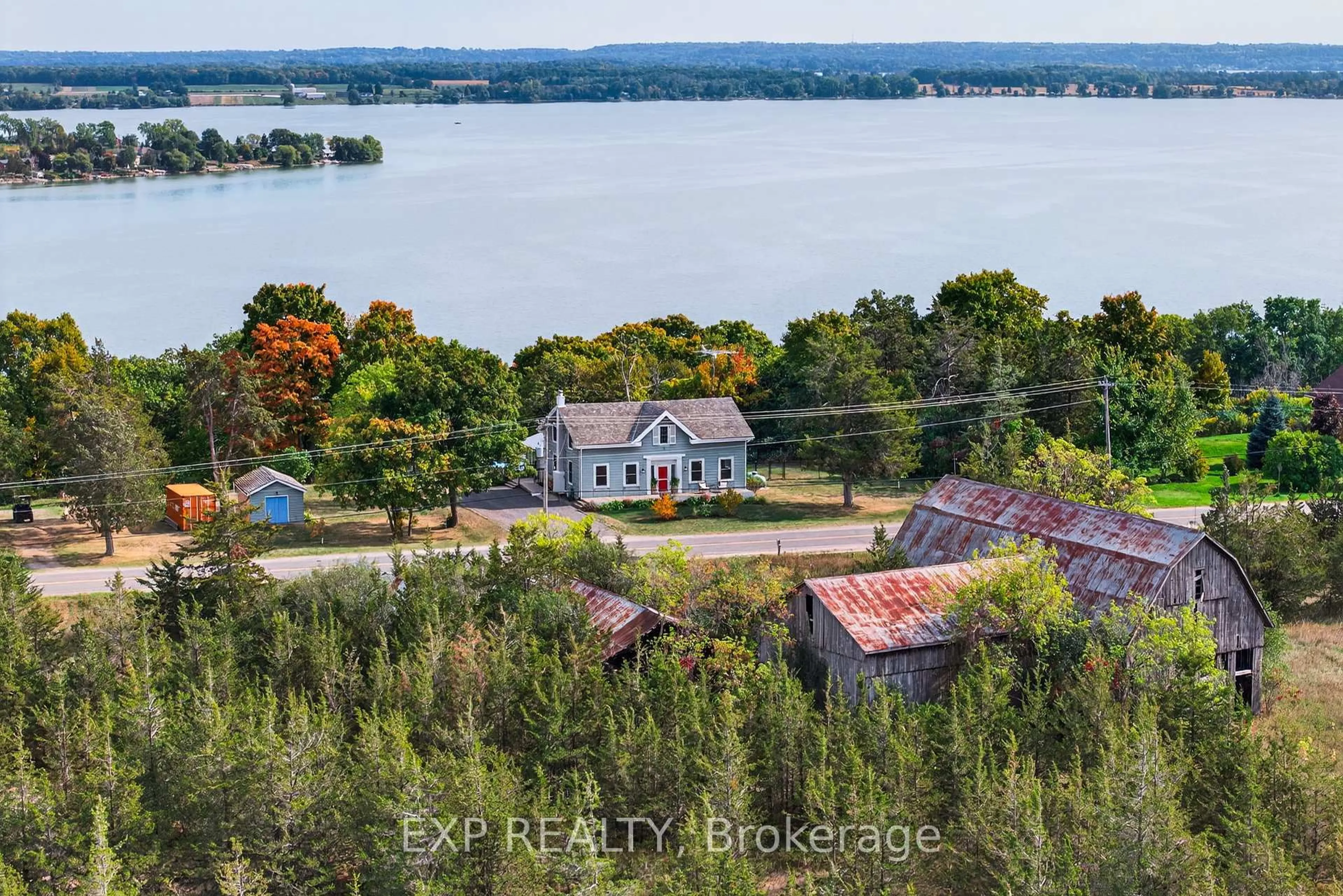 A pic from outside/outdoor area/front of a property/back of a property/a pic from drone, water/lake/river/ocean view for 130 County 35 Rd, Prince Edward County Ontario K0K 2T0