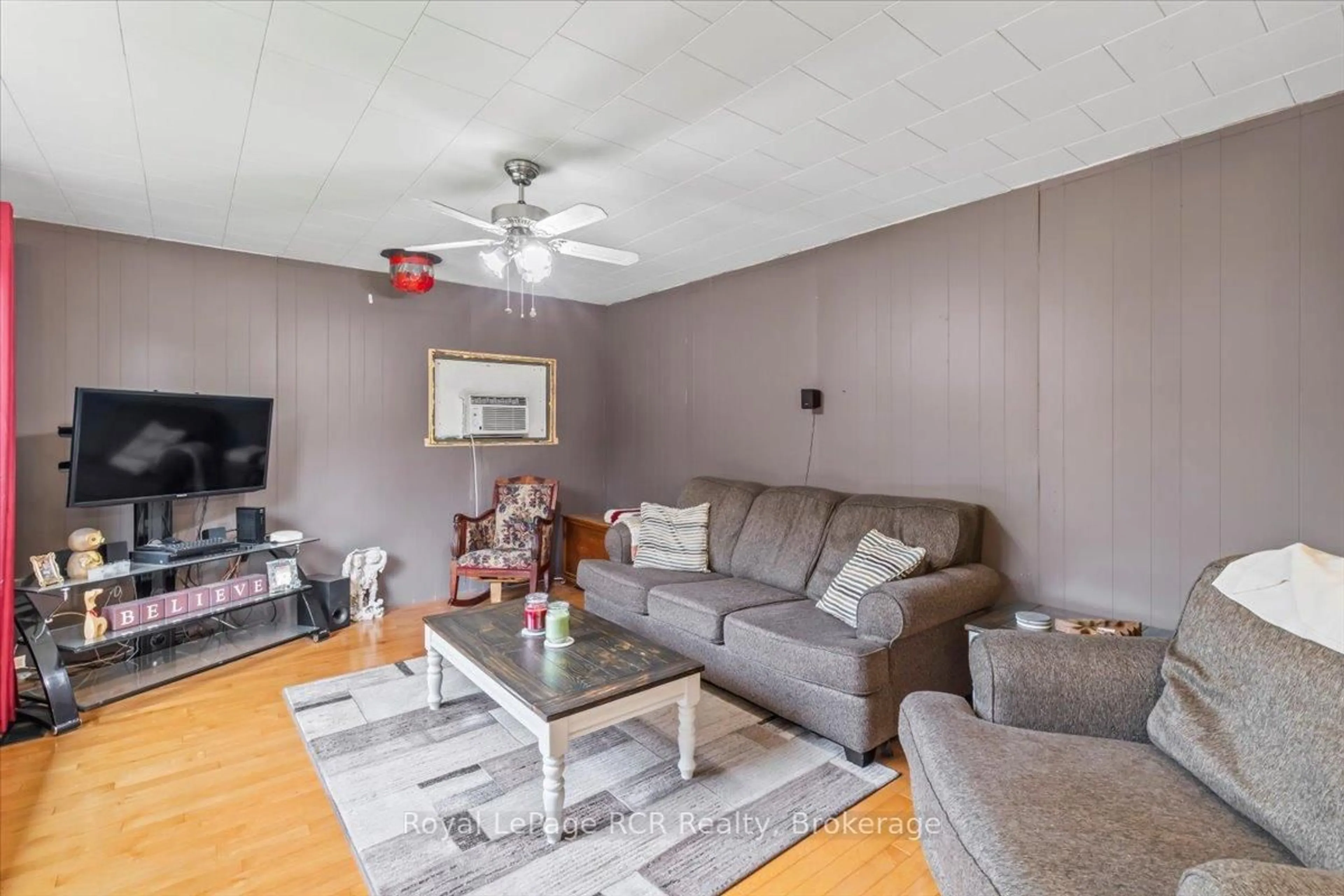 Living room with furniture, wood/laminate floor for 27 William St, West Grey Ontario N0G 1S0