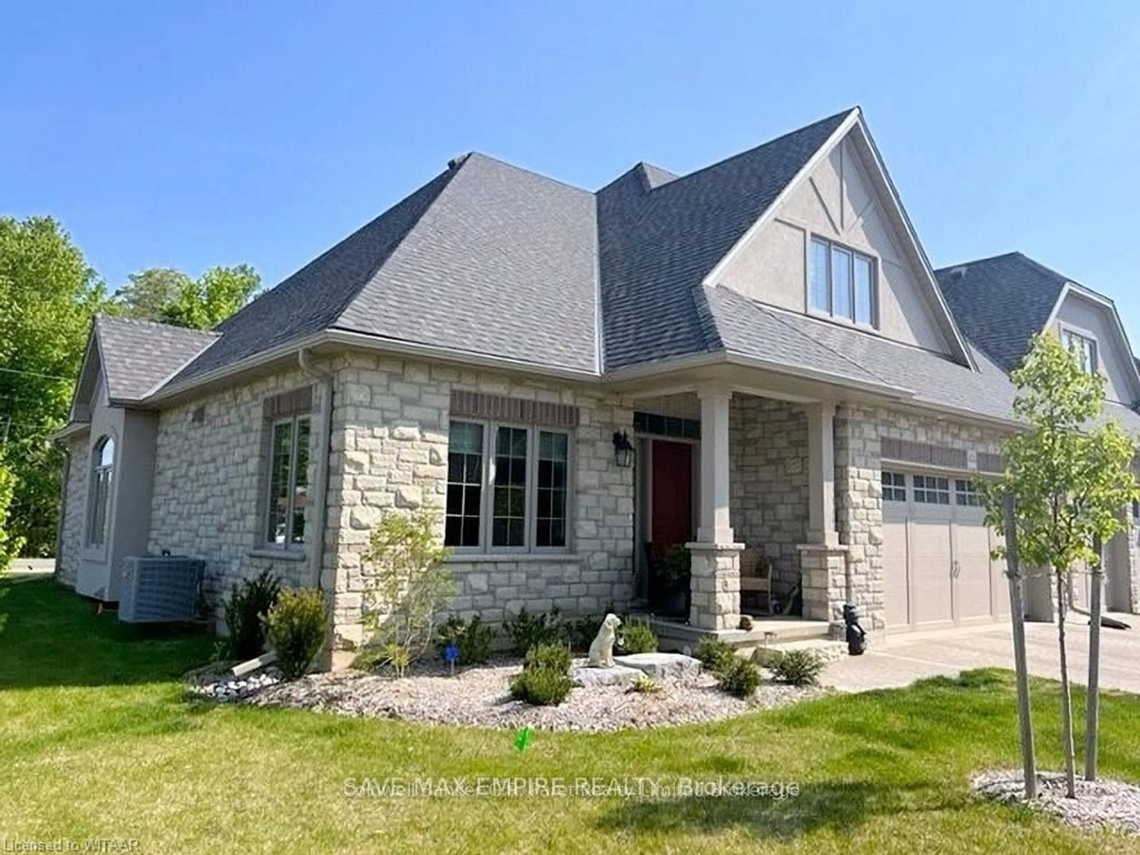 Home with brick exterior material, street for 5 Wood Haven Dr #404, Tillsonburg Ontario N4G 0A8