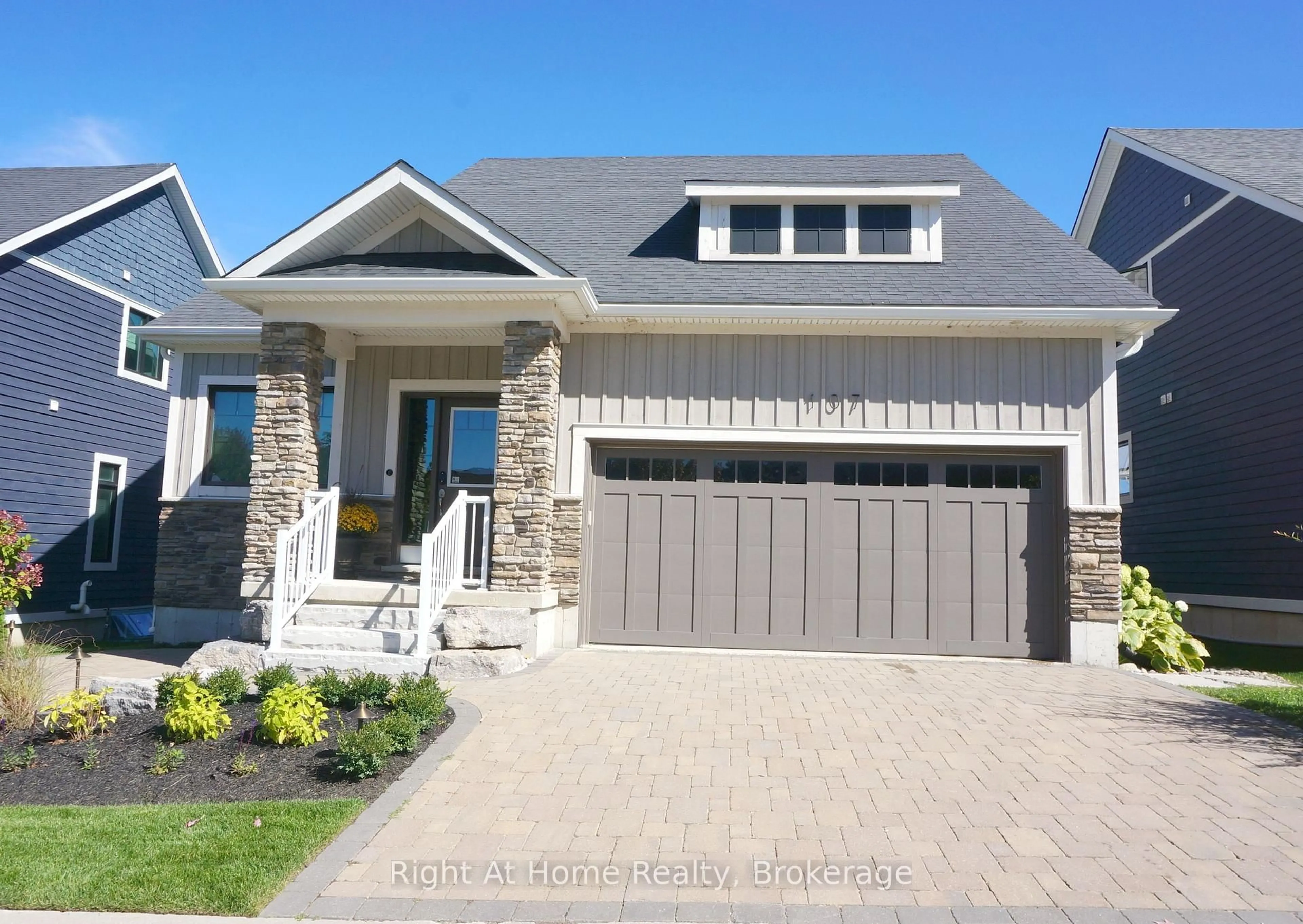 Home with brick exterior material, street for 107 Beacon Dr, Blue Mountains Ontario N0H 2P0