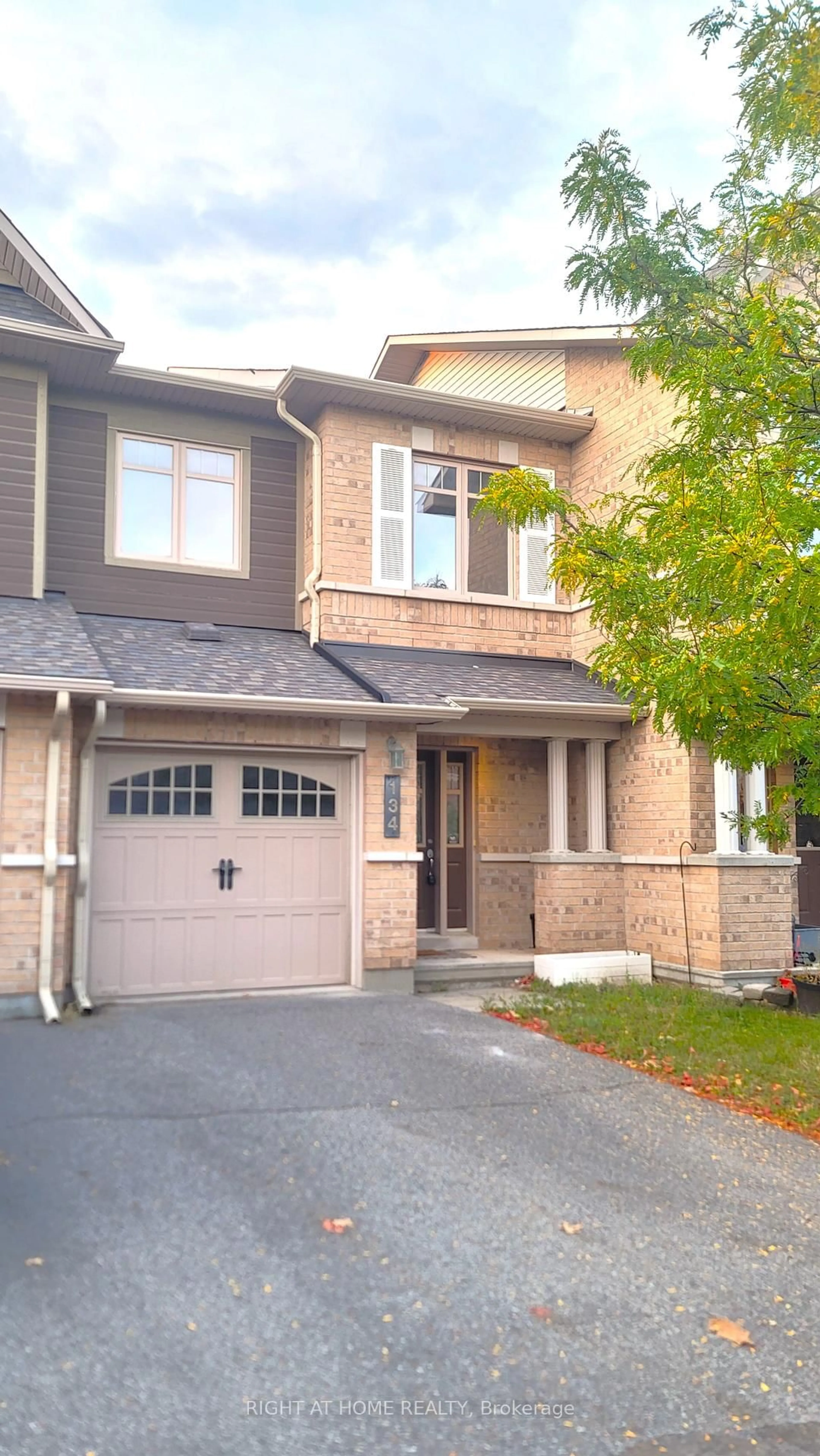 Home with brick exterior material, street for 134 Mancini Way, Ottawa Ontario K2J 3V1