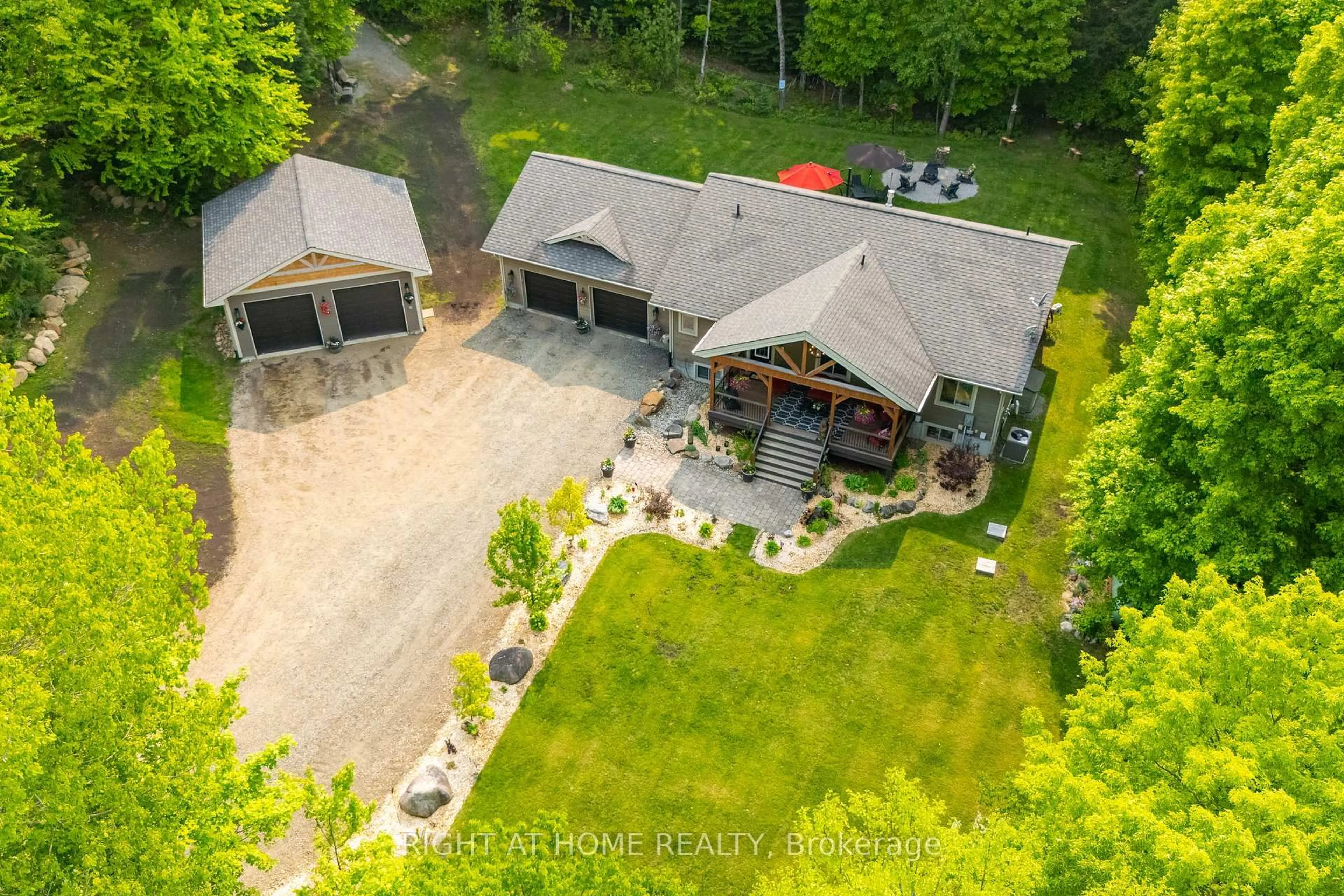 A pic from outside/outdoor area/front of a property/back of a property/a pic from drone, unknown for 12028 Highway 118 Highway, Dysart et al Ontario K0M 1S0