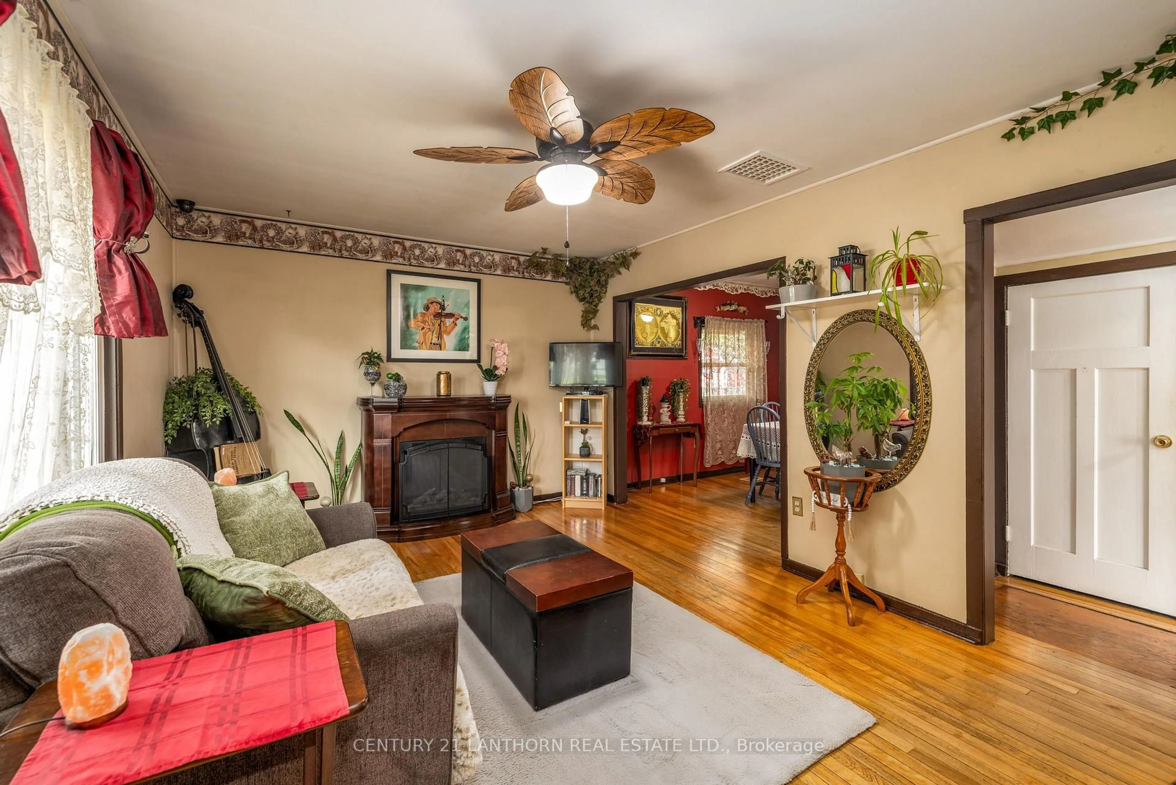 Living room with furniture, wood/laminate floor for 8 Johnson Rd, Quinte West Ontario K8V 2W7