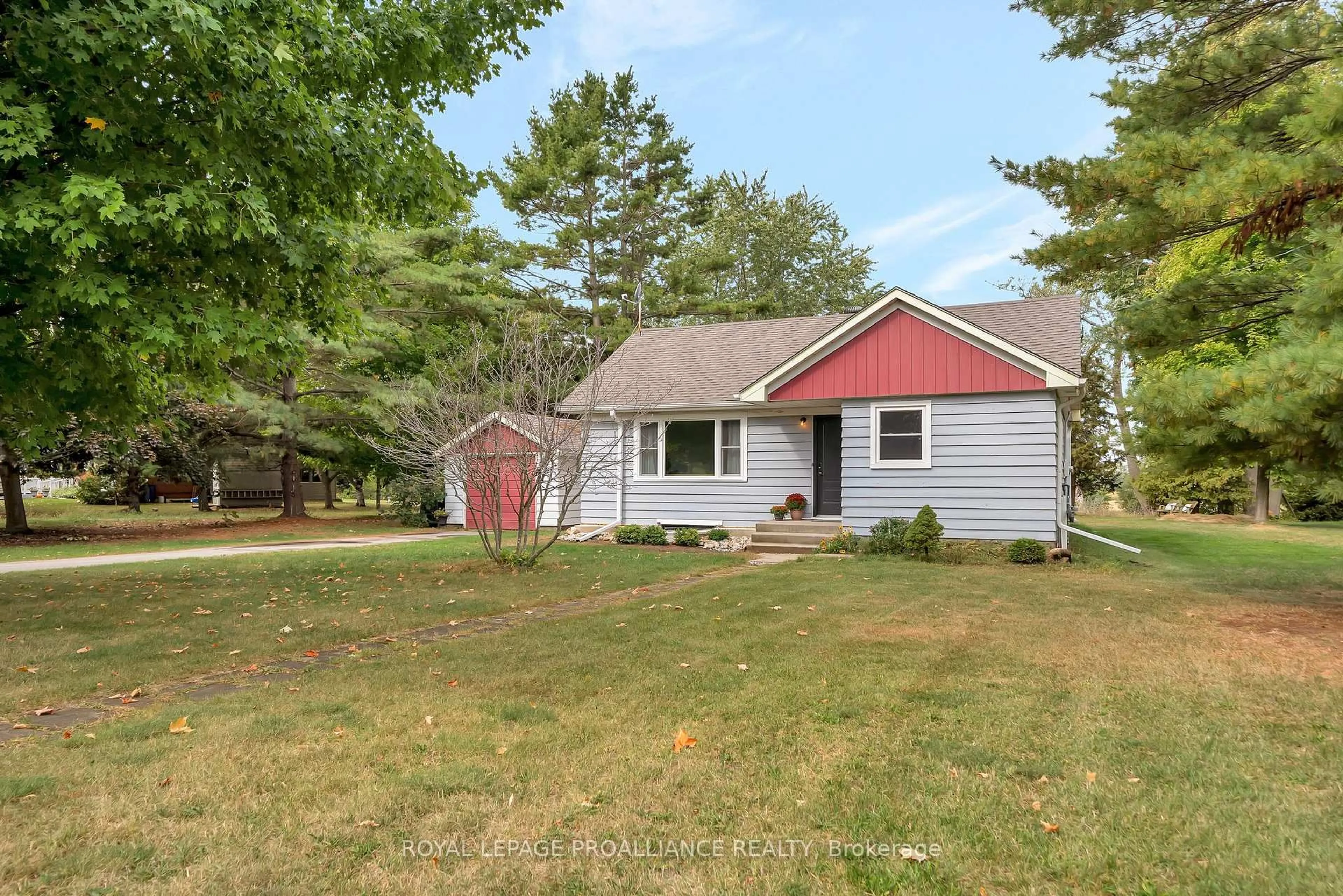 Home with vinyl exterior material, street for 1446 County Road 12, Prince Edward County Ontario K0K 2T0