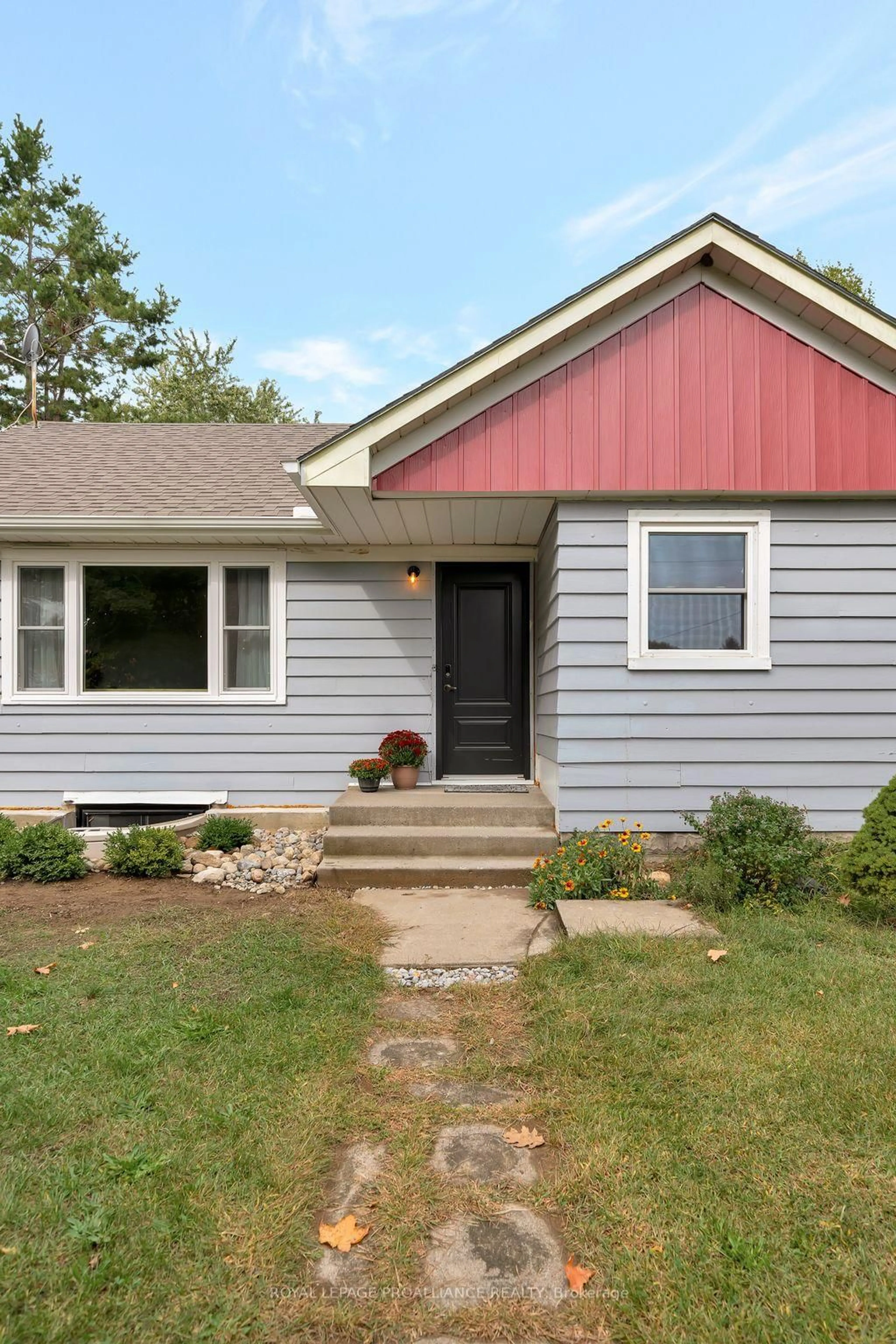 Home with vinyl exterior material, street for 1446 County Road 12, Prince Edward County Ontario K0K 2T0