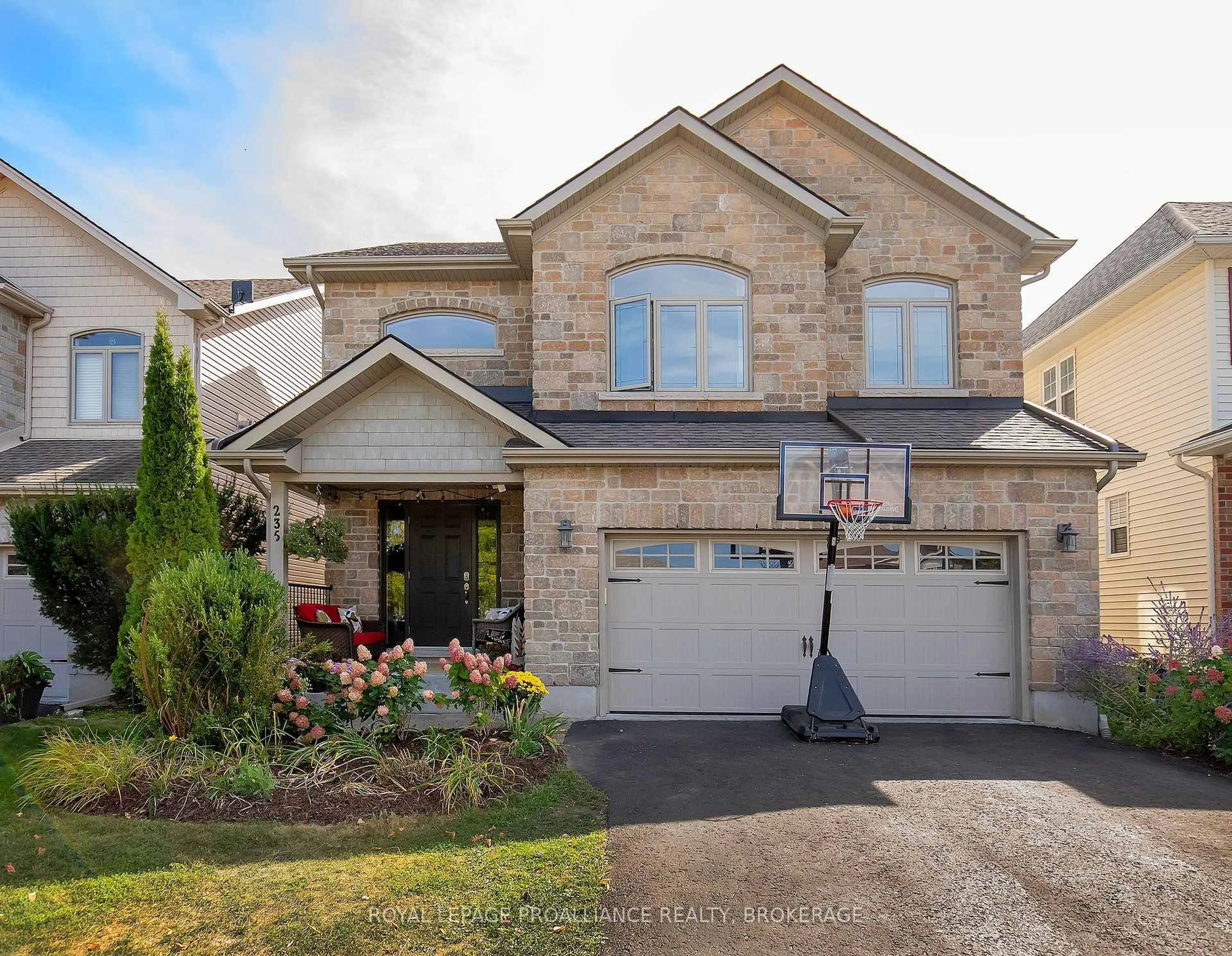 Home with brick exterior material, street for 235 Rose Abbey Dr, Kingston Ontario K7K 0A2