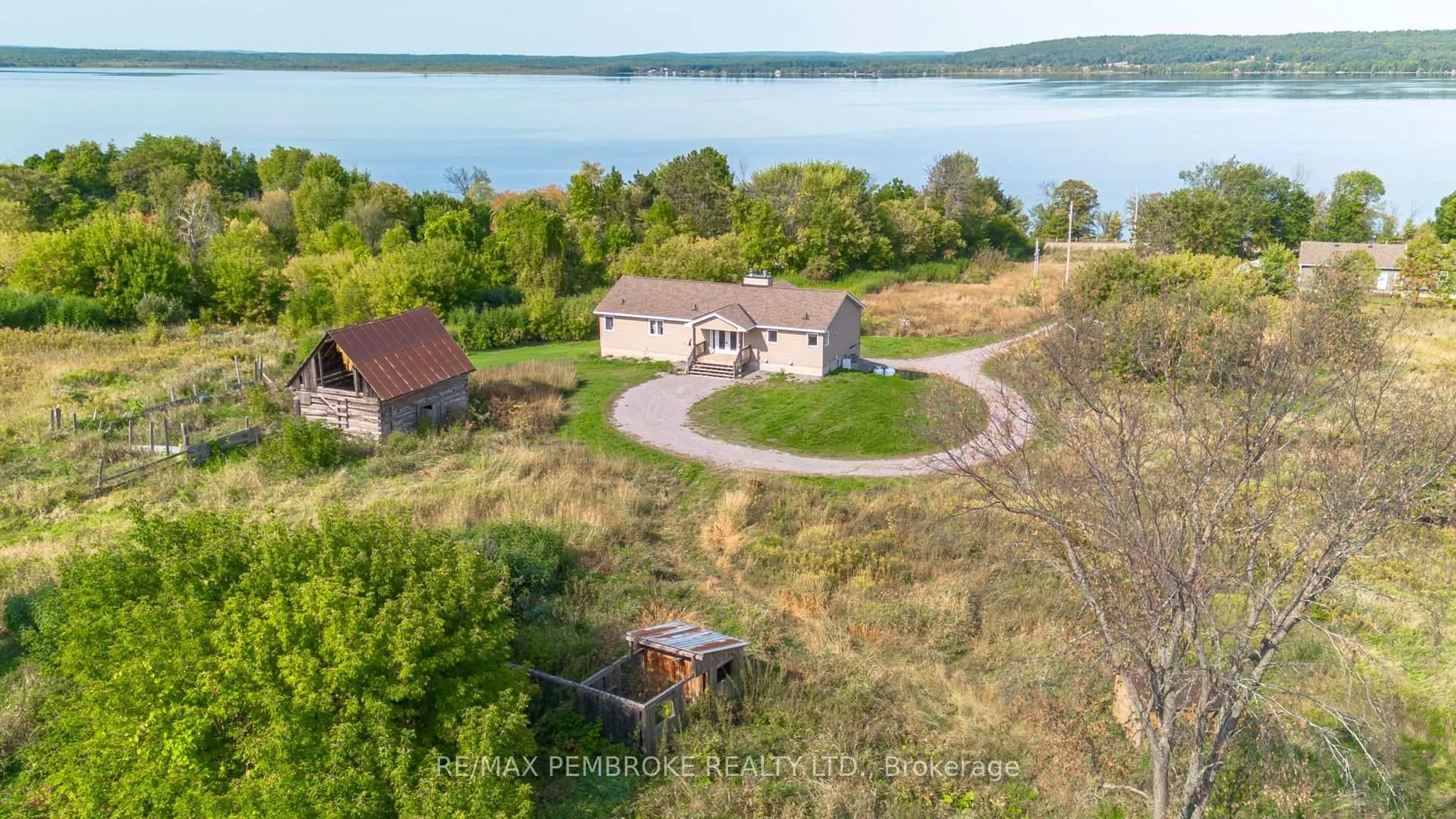 A pic from outside/outdoor area/front of a property/back of a property/a pic from drone, water/lake/river/ocean view for 36752 41 Highway, Eganville Ontario K0J 1T0