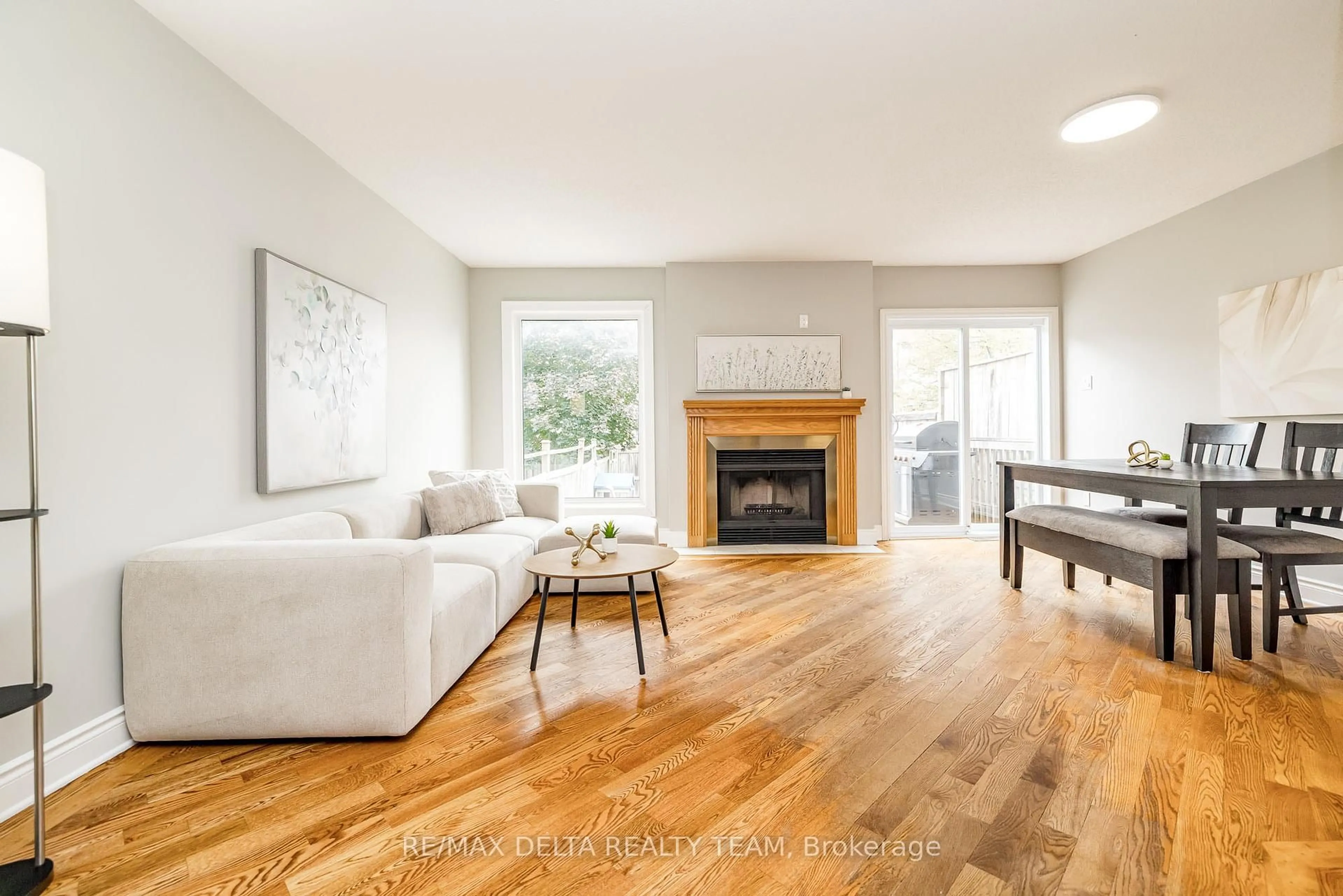 Living room with furniture, wood/laminate floor for 1540 Briarfield Cres, Ottawa Ontario K4A 1Z9