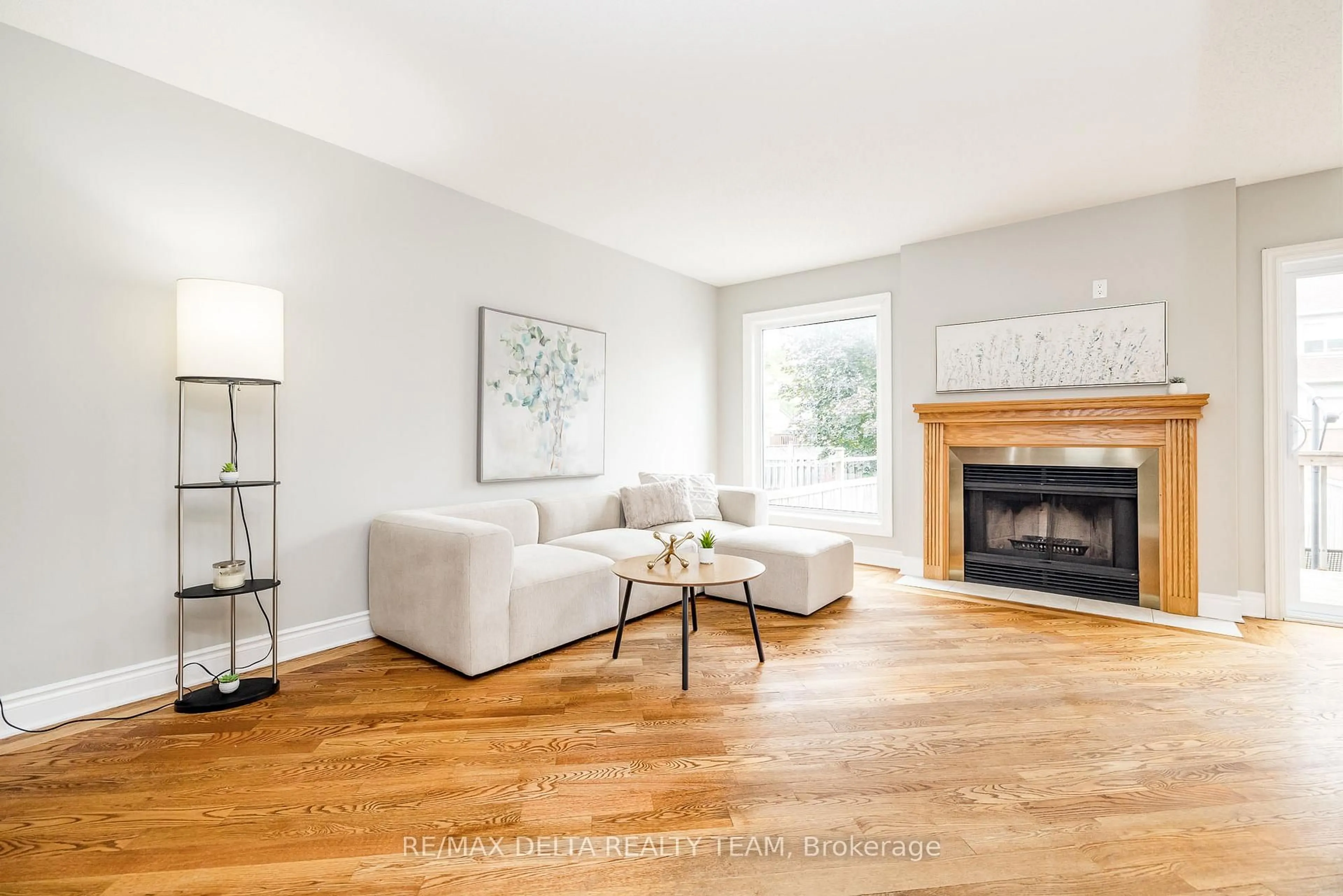 Living room with furniture, wood/laminate floor for 1540 Briarfield Cres, Ottawa Ontario K4A 1Z9