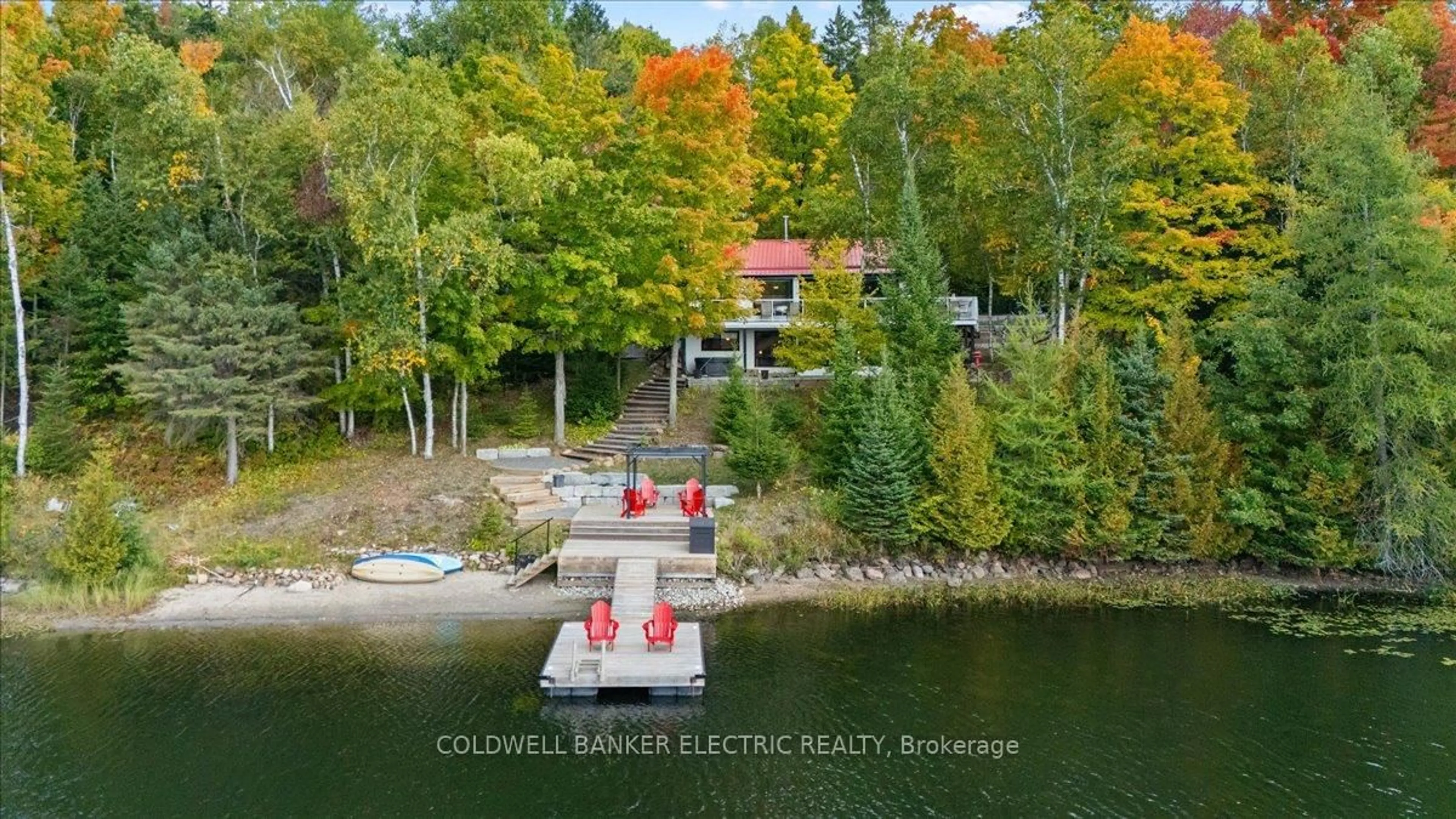 A pic from outside/outdoor area/front of a property/back of a property/a pic from drone, water/lake/river/ocean view for 37 Fire Route 296, Trent Lakes Ontario K0L 1J0