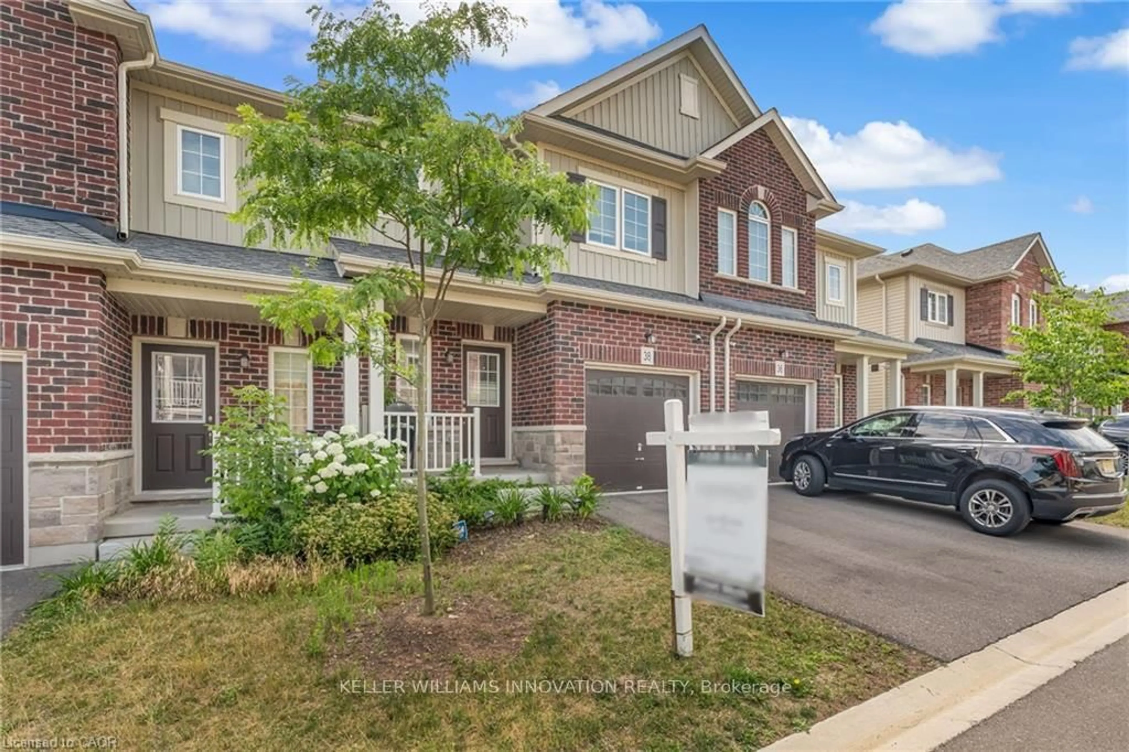 Home with brick exterior material, street for 38 Dewberry Dr, Kitchener Ontario N2B 0A9