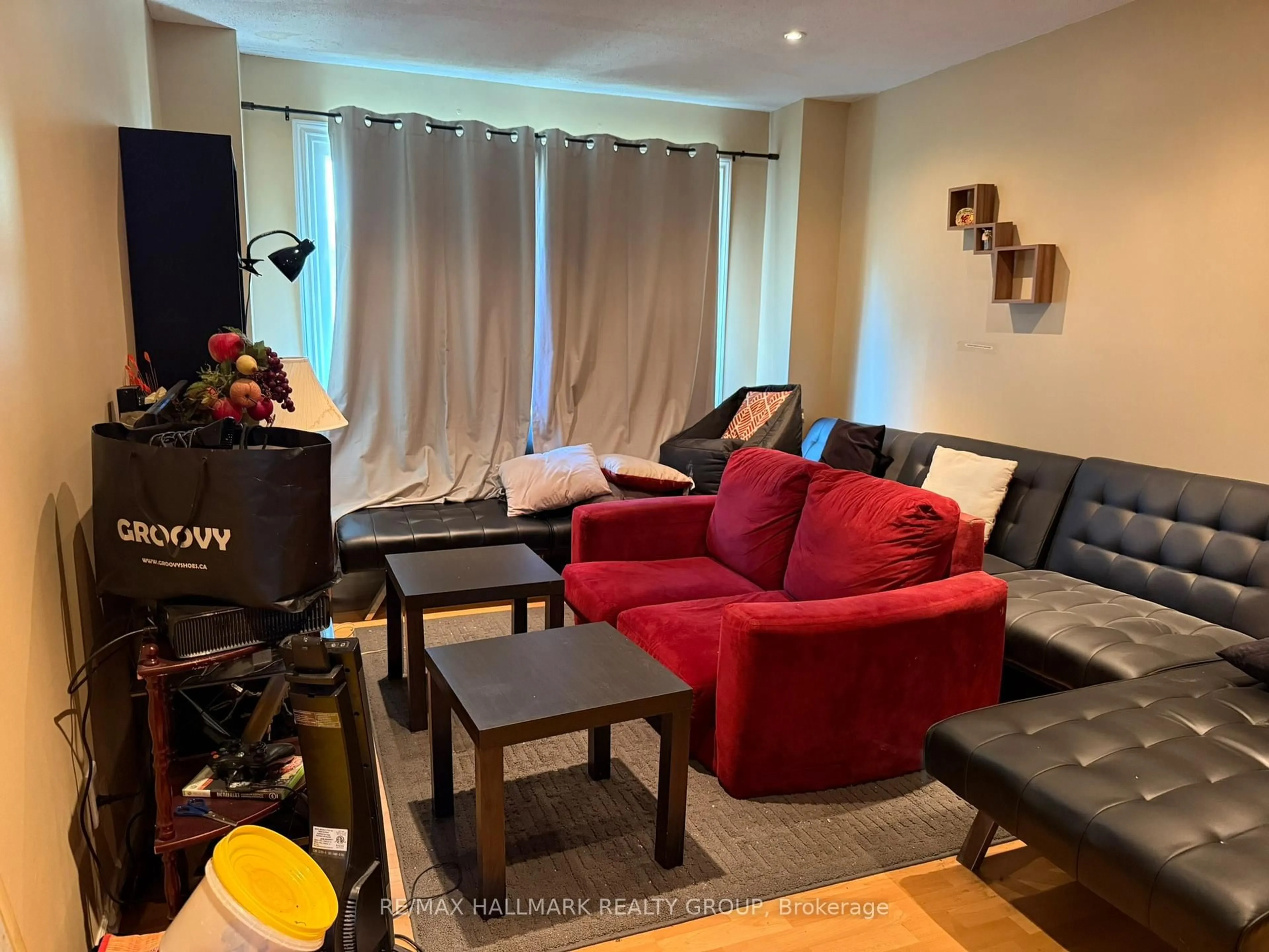 Living room with furniture, wood/laminate floor for 930 Cahill Dr, Ottawa Ontario K1V 9B5