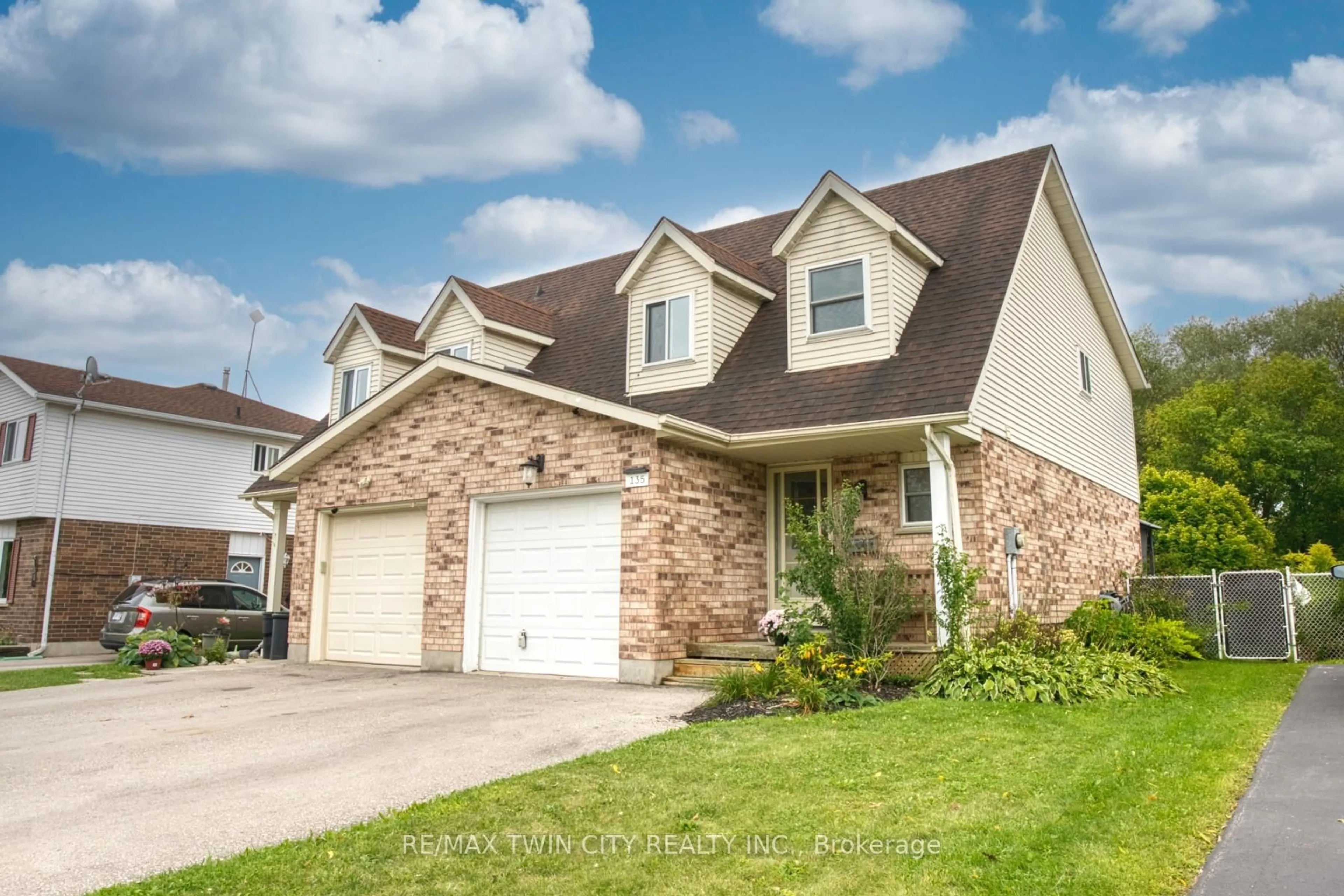 Home with brick exterior material, street for 135 Eastforest Tr, Kitchener Ontario N2N 3E4