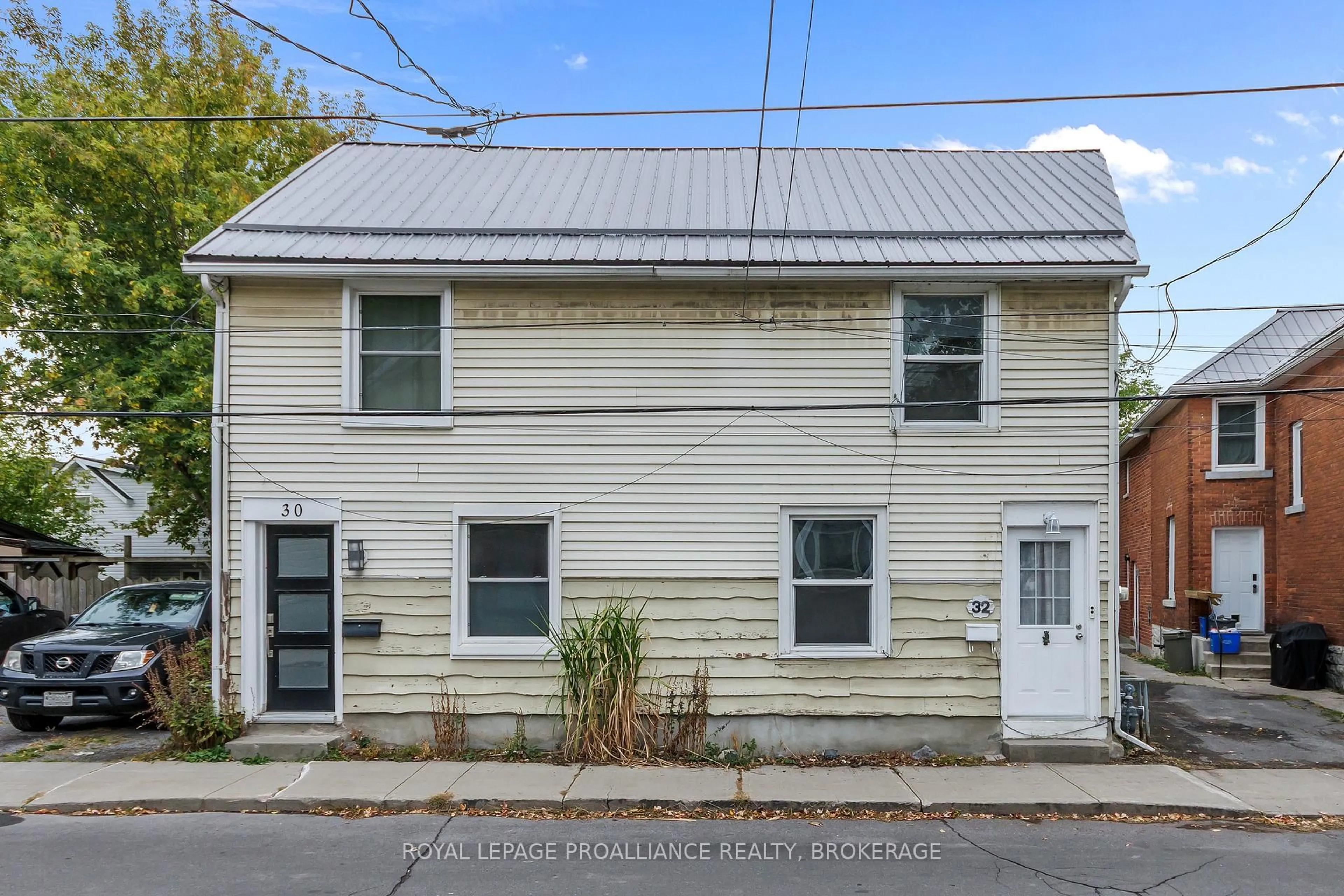 Home with vinyl exterior material, street for 32 Main St, Kingston Ontario K7K 3Y4