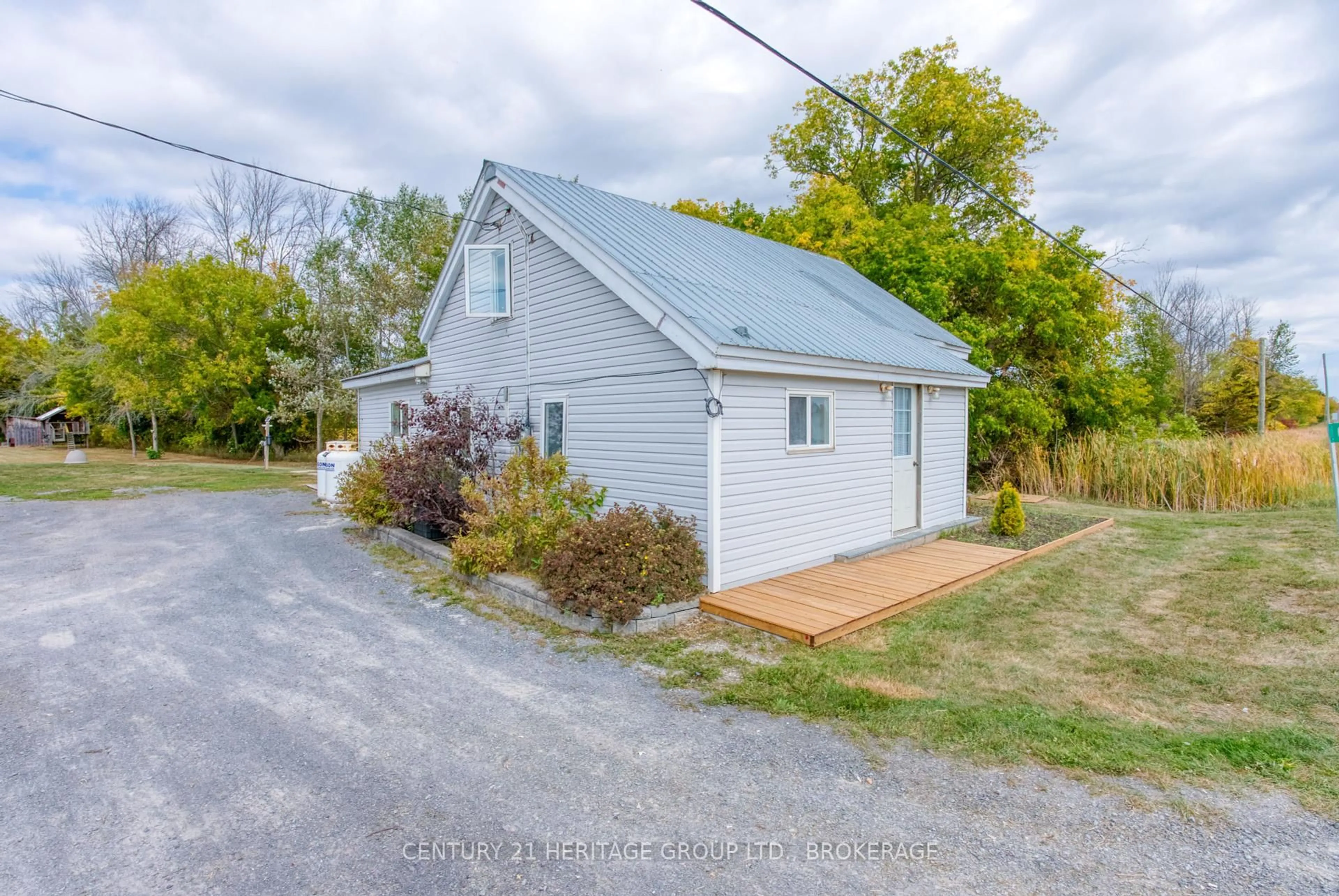 A pic from outside/outdoor area/front of a property/back of a property/a pic from drone, street for 6913 County 2 Rd, Napanee Ontario K7R 3K6