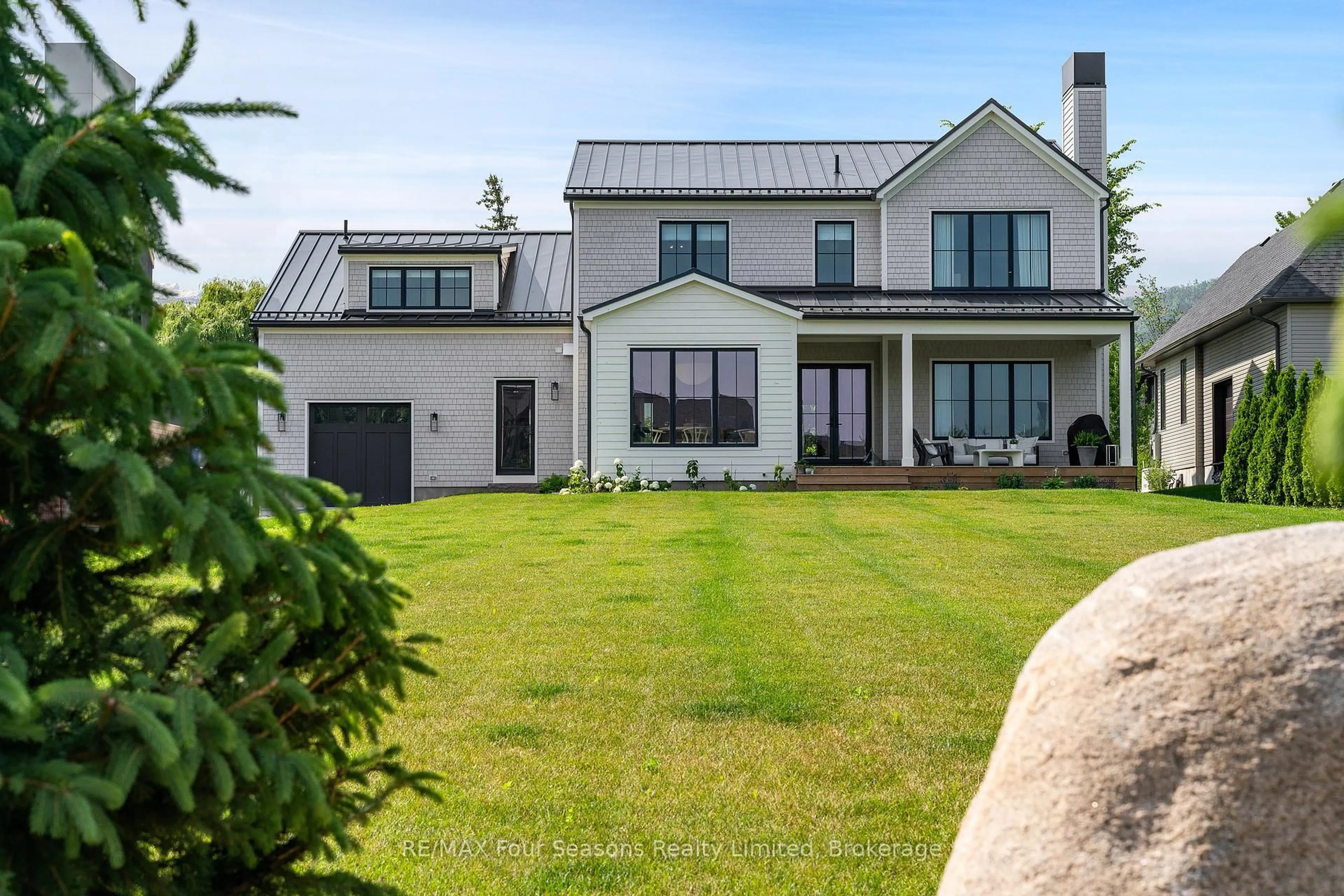 A pic from outside/outdoor area/front of a property/back of a property/a pic from drone, mountain view for 111 Lendvay Ally, Blue Mountains Ontario L9Y 0S3