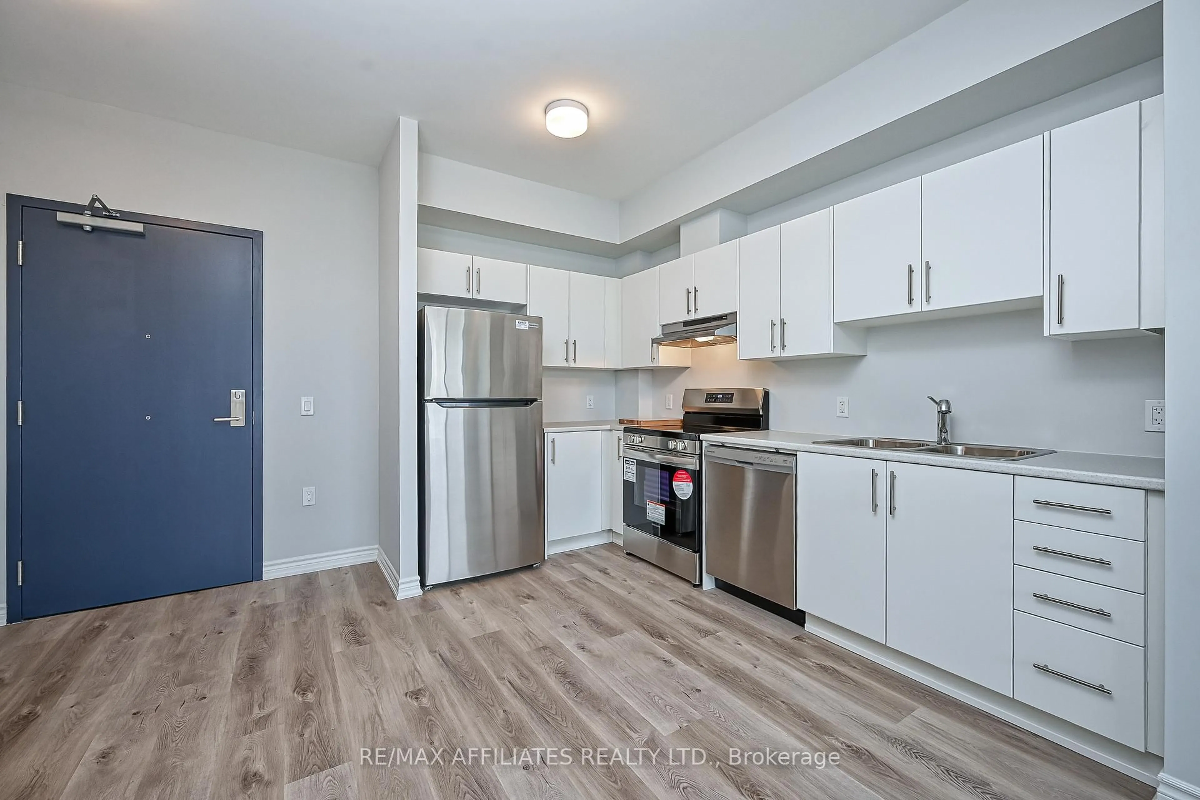 Standard kitchen, wood/laminate floor for 397 Codds Rd #203, Ottawa Ontario K1K 2G8