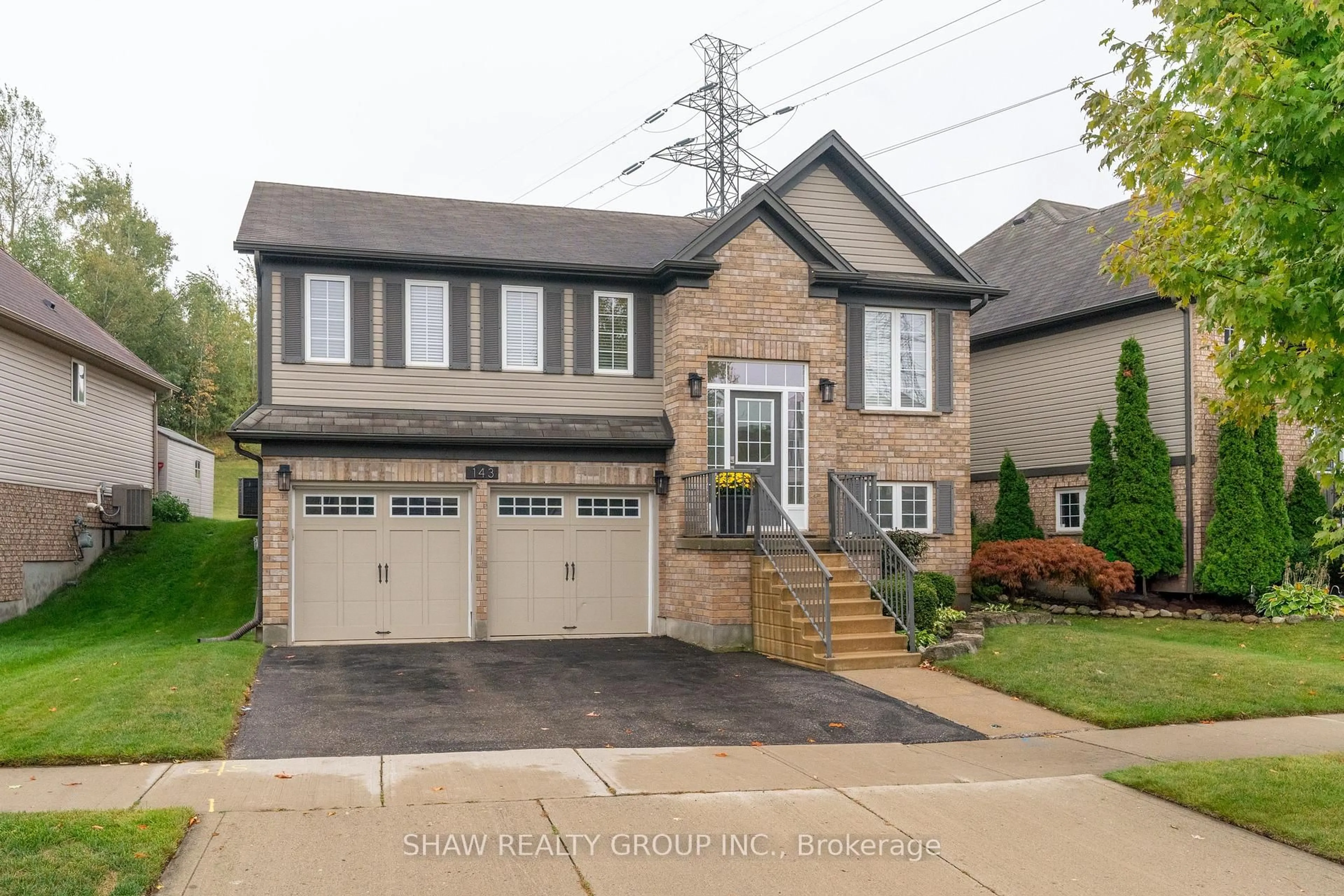 Home with brick exterior material, street for 143 Isaiah Dr, Kitchener Ontario N2E 0B6