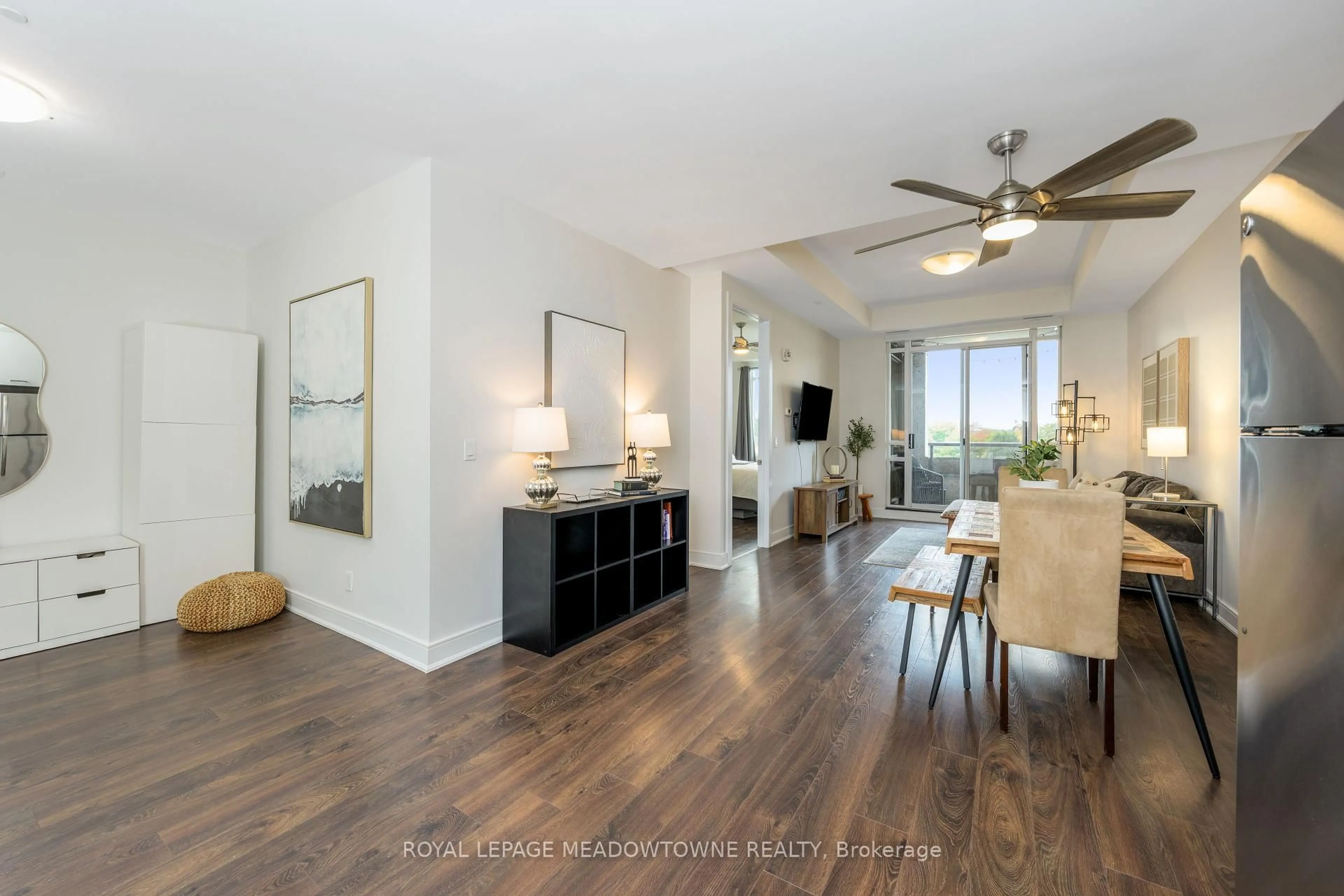 Living room with furniture, wood/laminate floor for 150 Main St #505, Hamilton Ontario L8P 1H8