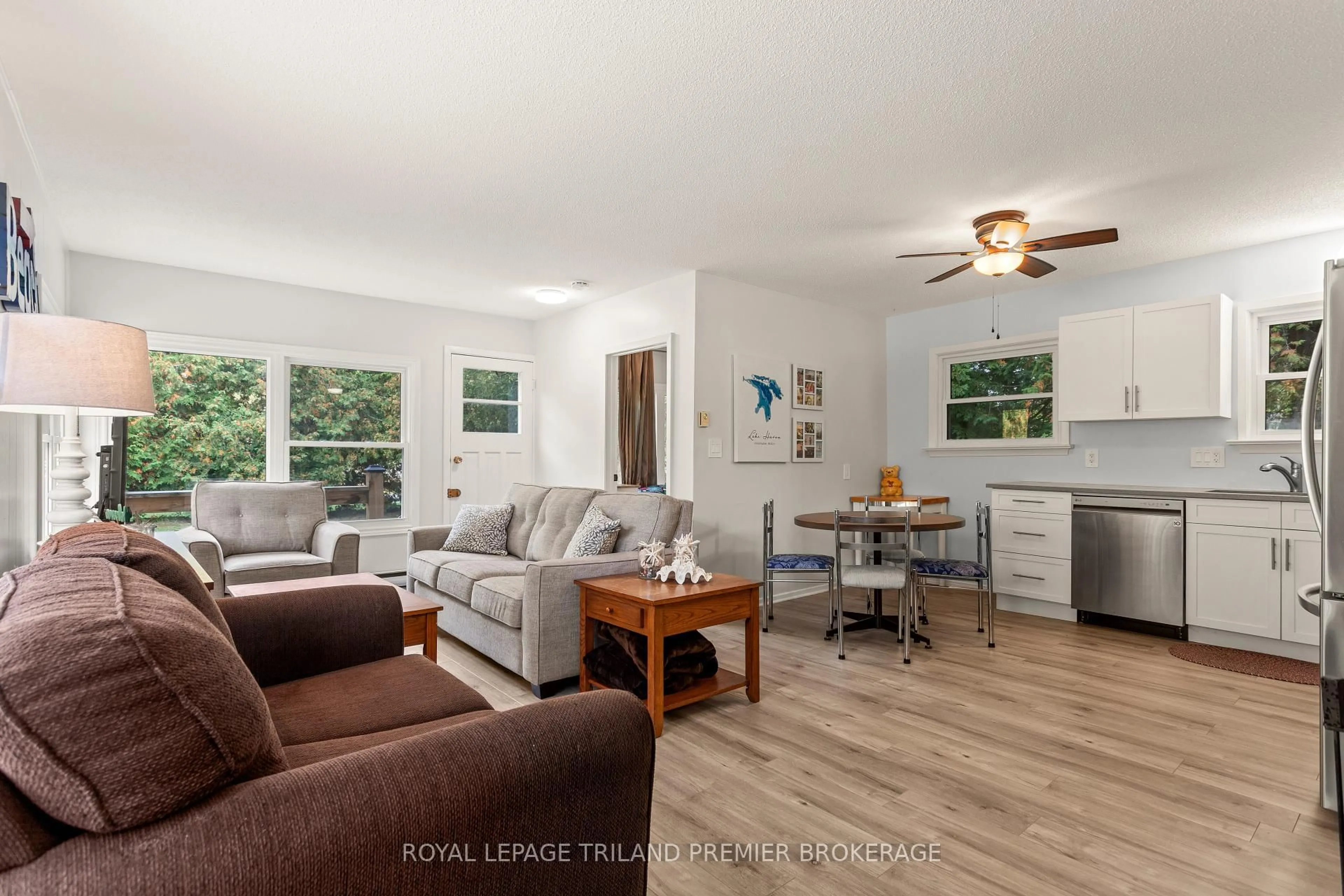 Living room with furniture, wood/laminate floor for 9632 Beachway Dr, Lambton Shores Ontario N0N 1J3