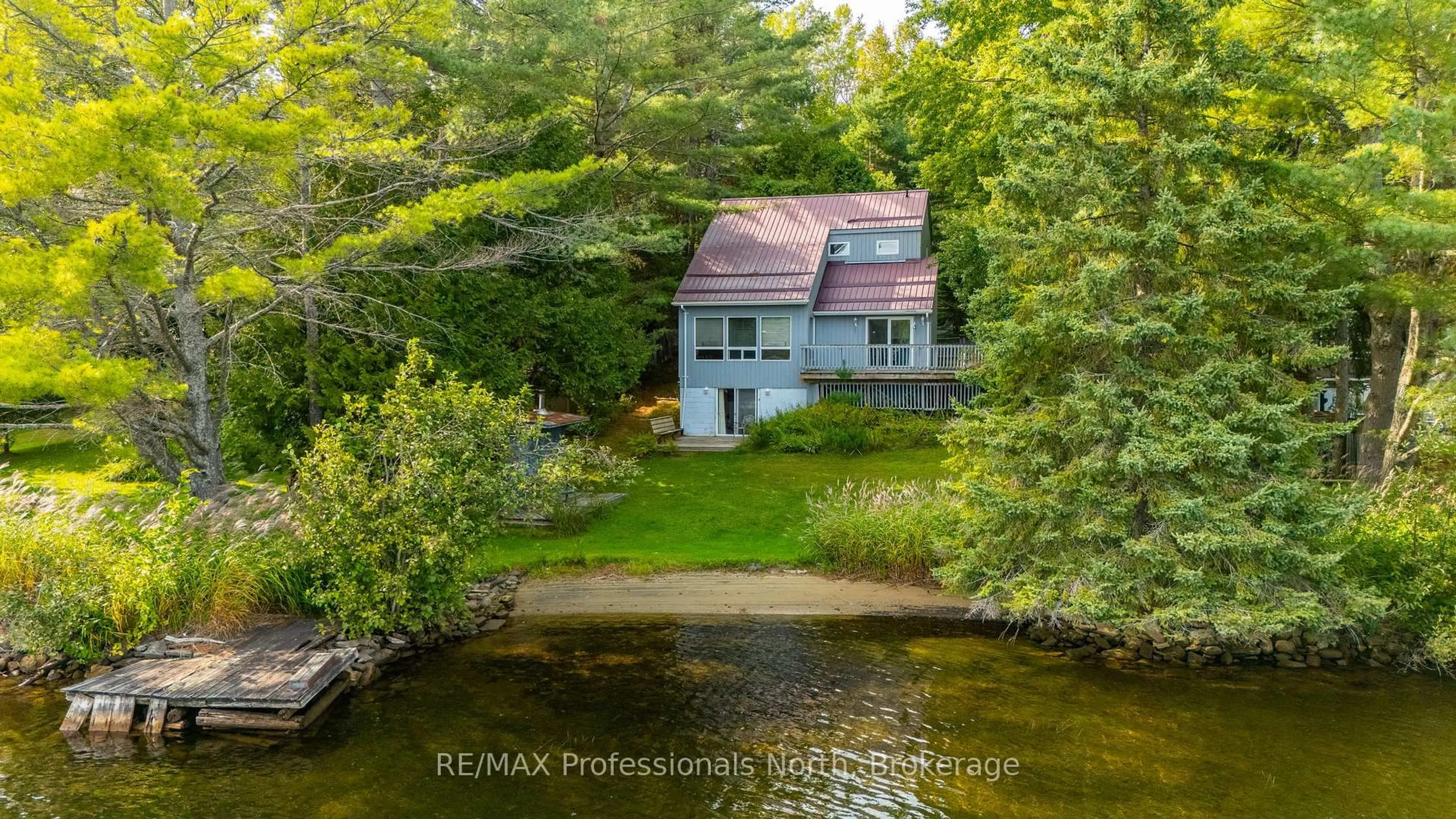 A pic from outside/outdoor area/front of a property/back of a property/a pic from drone, water/lake/river/ocean view for 1080 Petticoat Lane, Minden Hills Ontario K0M 2K0